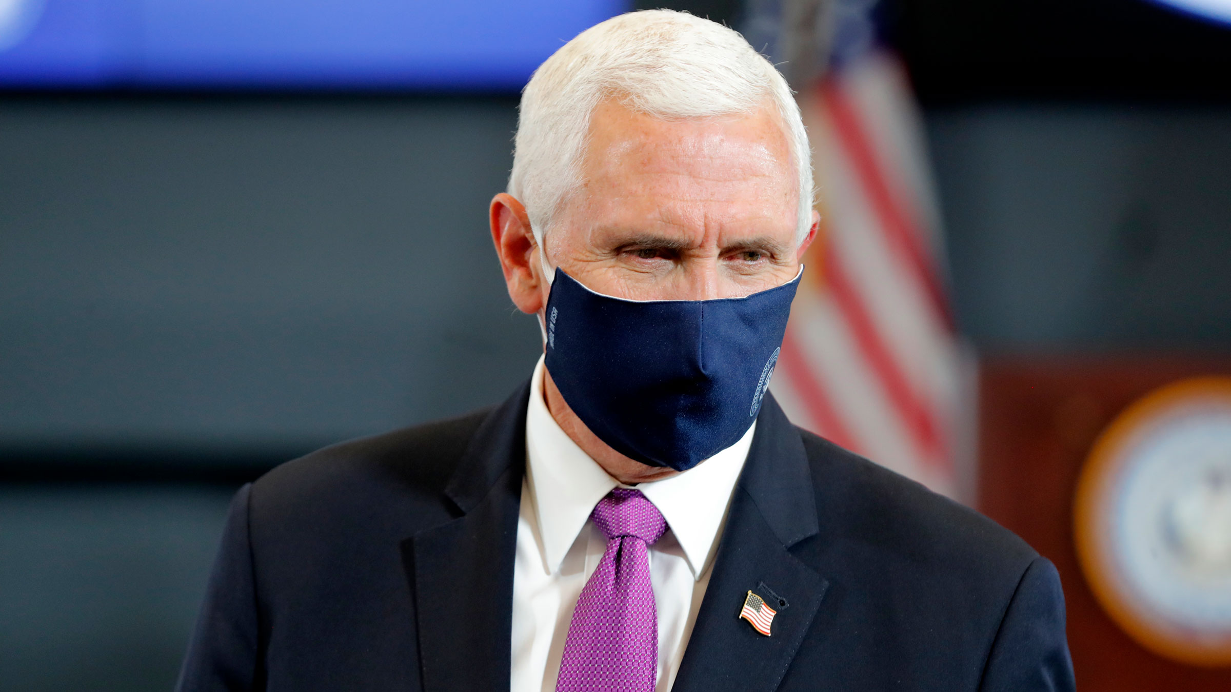 Vice President Mike Pence wears a mask Tuesday as he visits the state Emergency Operations Center in Baton Rouge, Louisiana.