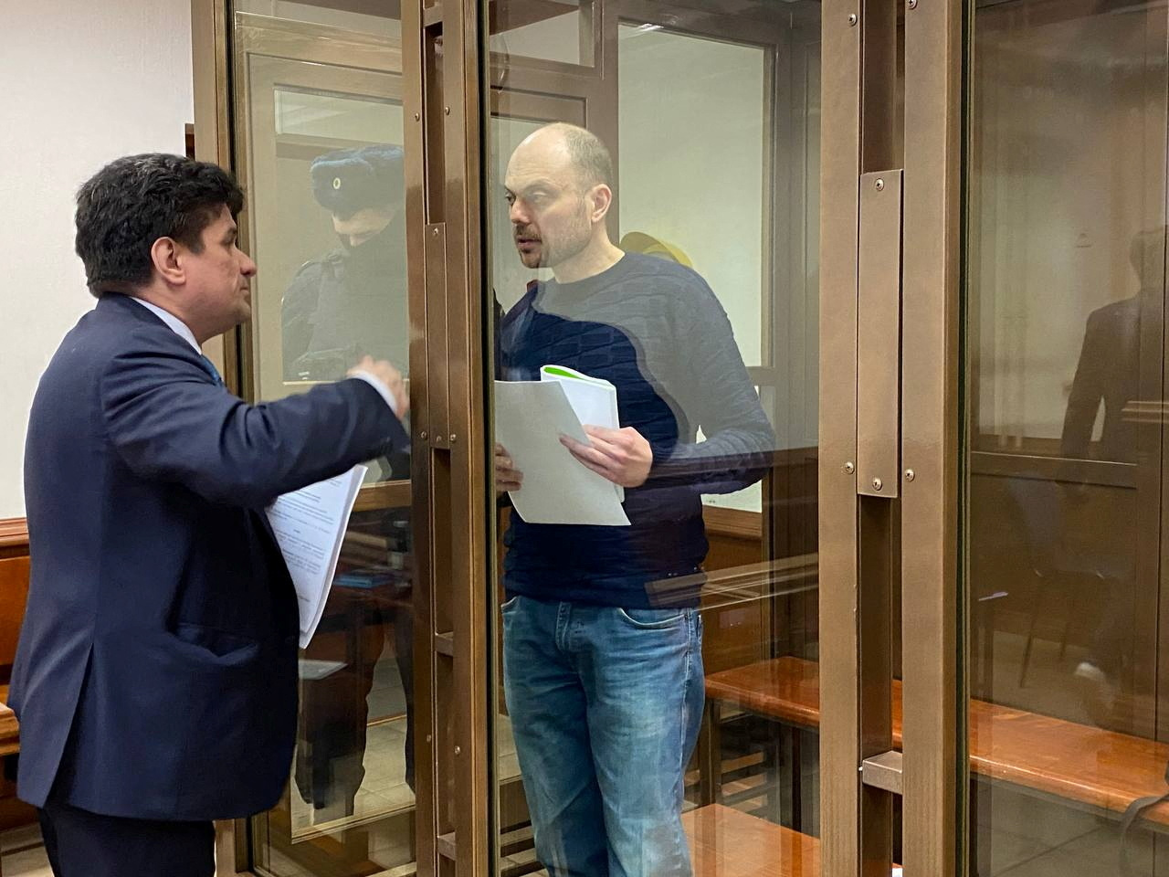Vladimir Kara-Murza, talks to his lawyer Vadim Prokhorov during a preliminary court hearing in Moscow, Russia on Monday.