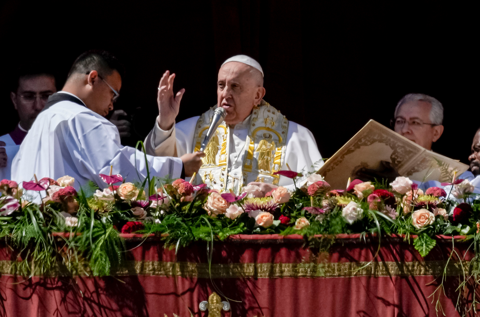 Pope Francis speaks from St. Peter's Basilica at The Vatican, on Sunday, April 9. 