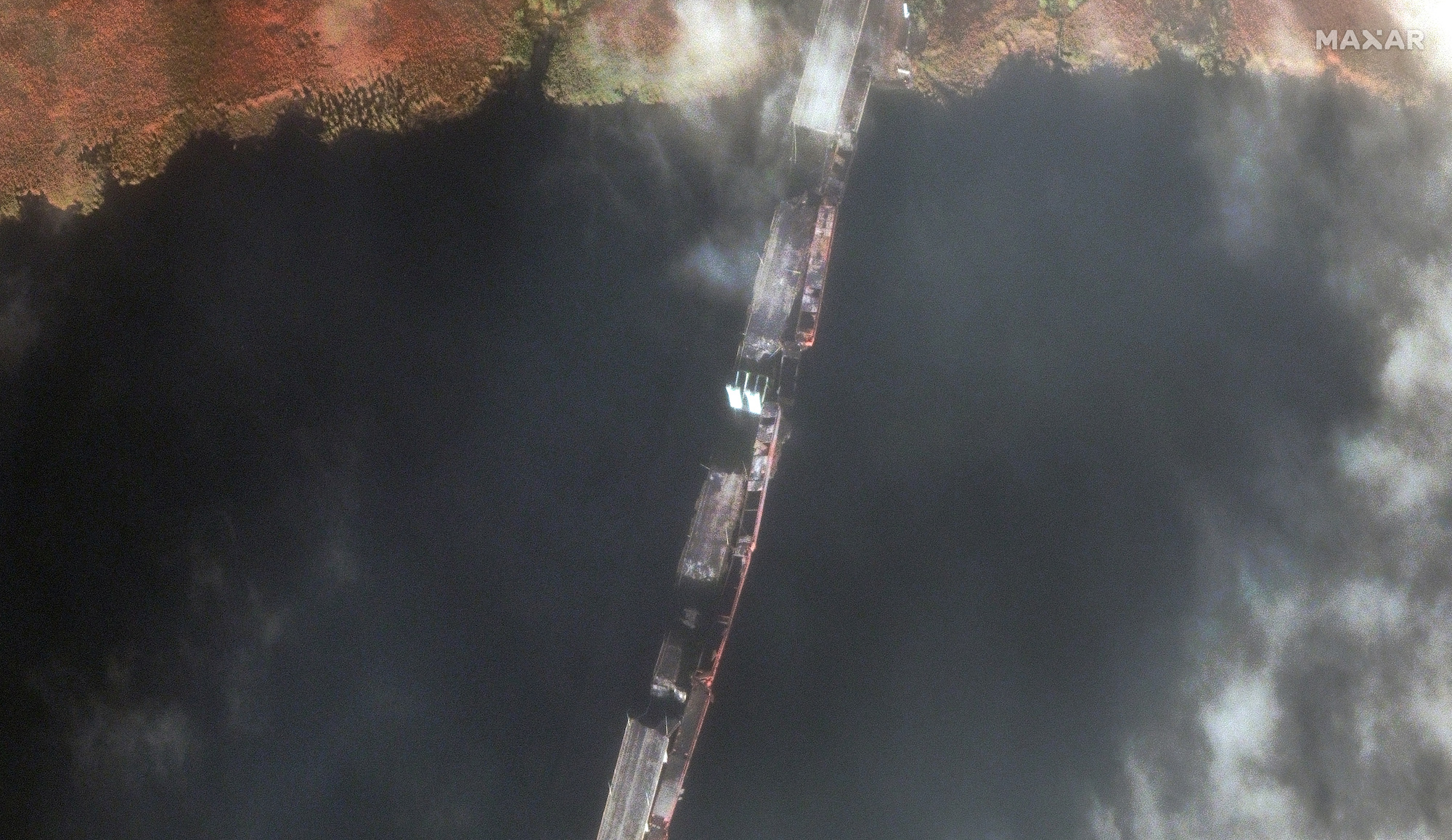 A close-up satellite image shows damage to the Antonivskyi vehicle bridge on the Dnipro River, Kherson region.