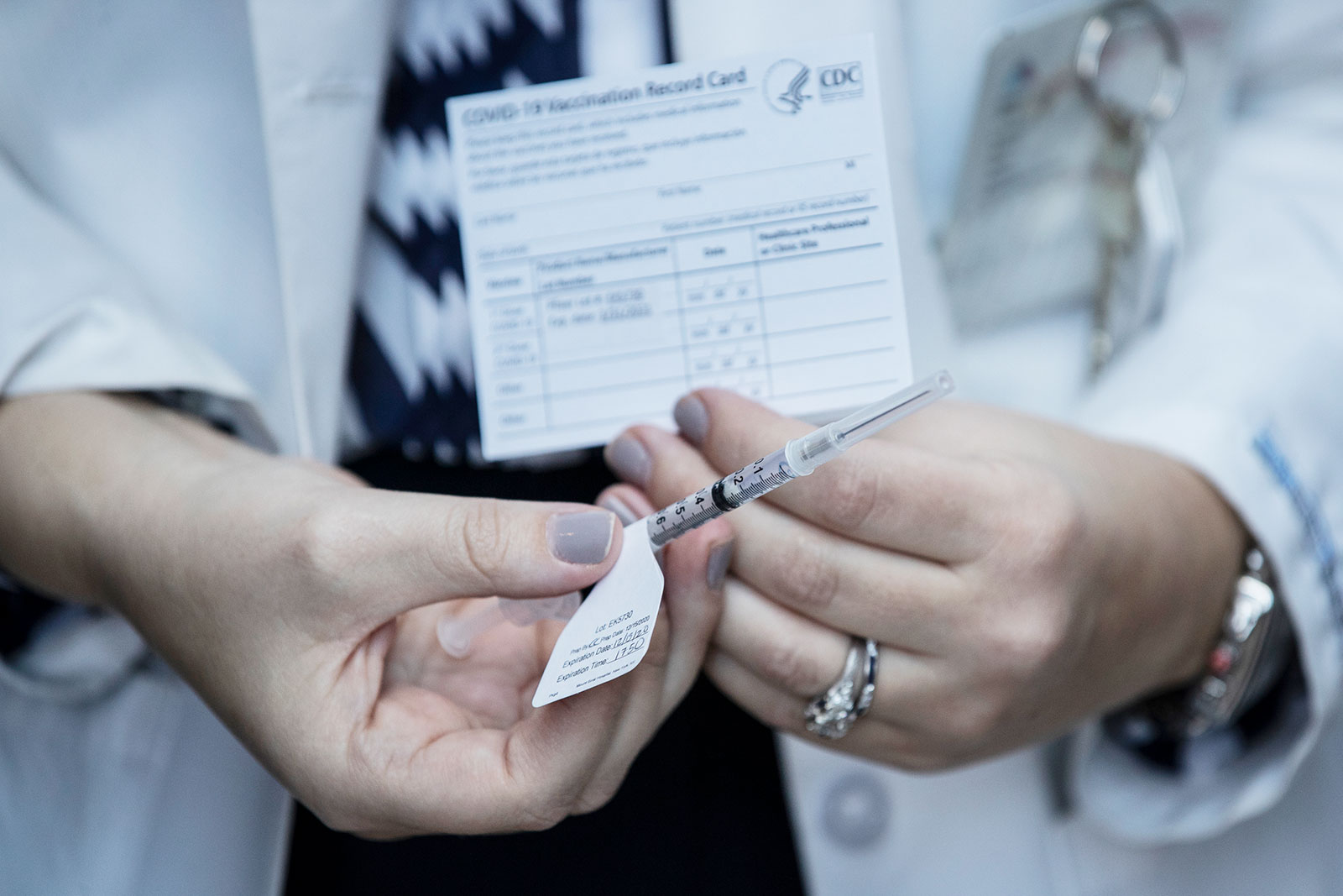 Dr. Victoria Adams, Infectious Diseases Clinical Pharmacist, holds one of the first Pfizer Covid-19 vaccine doses in the vaccination pod at Mt. Sinai Hospital in New York, on Tuesday, December 15.