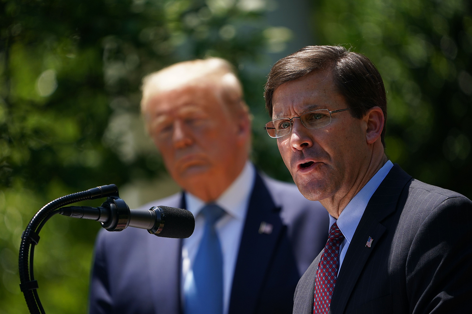 US Defense Secretary Mark Esper, with US President Donald Trump, speaks on vaccine development  in the Rose Garden of the White House in Washington, DC on May 15,.