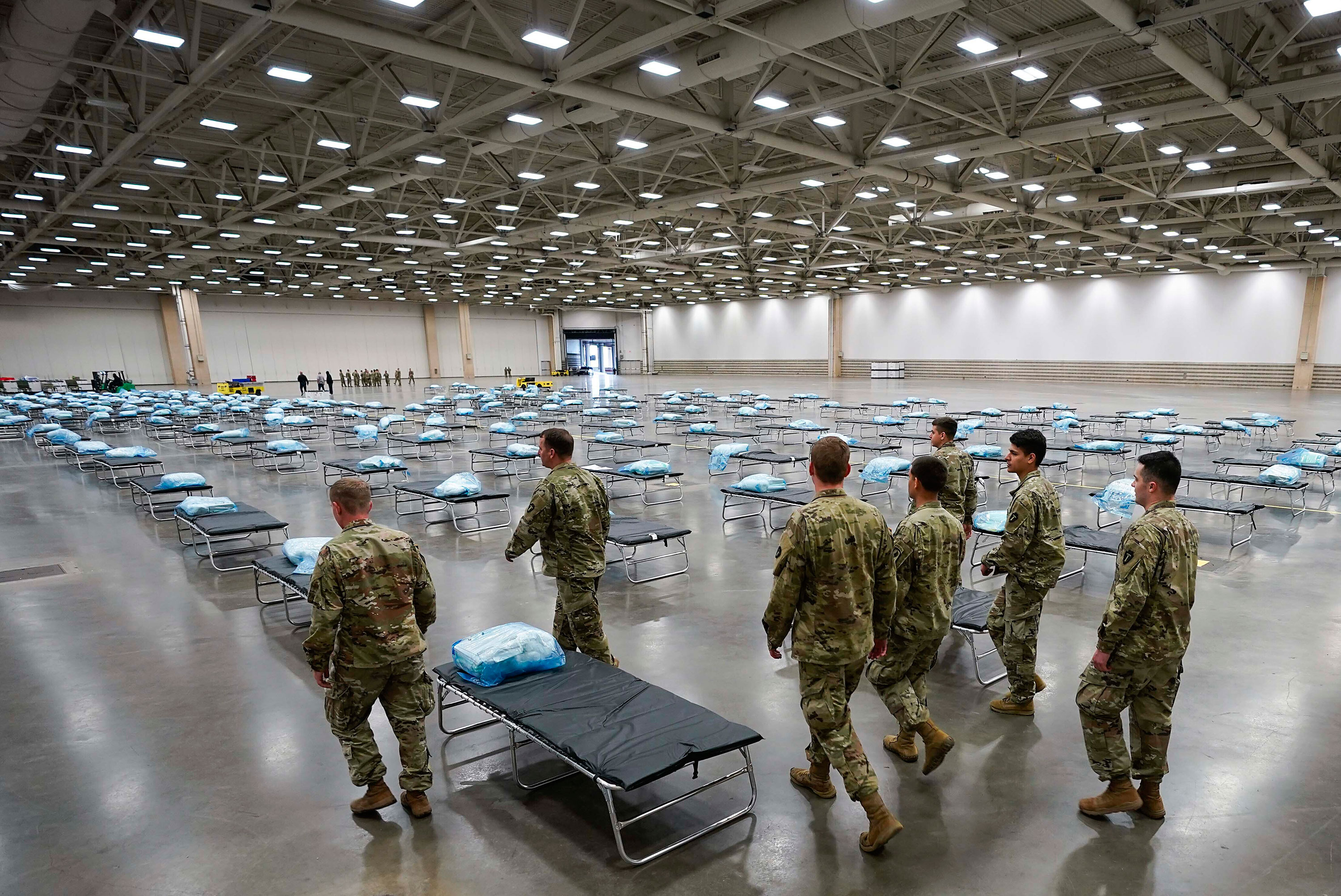 Texas Army National Guardsmen set up a field hospital at the Kay Bailey Hutchison Convention Center on March 31, in Dallas. 
