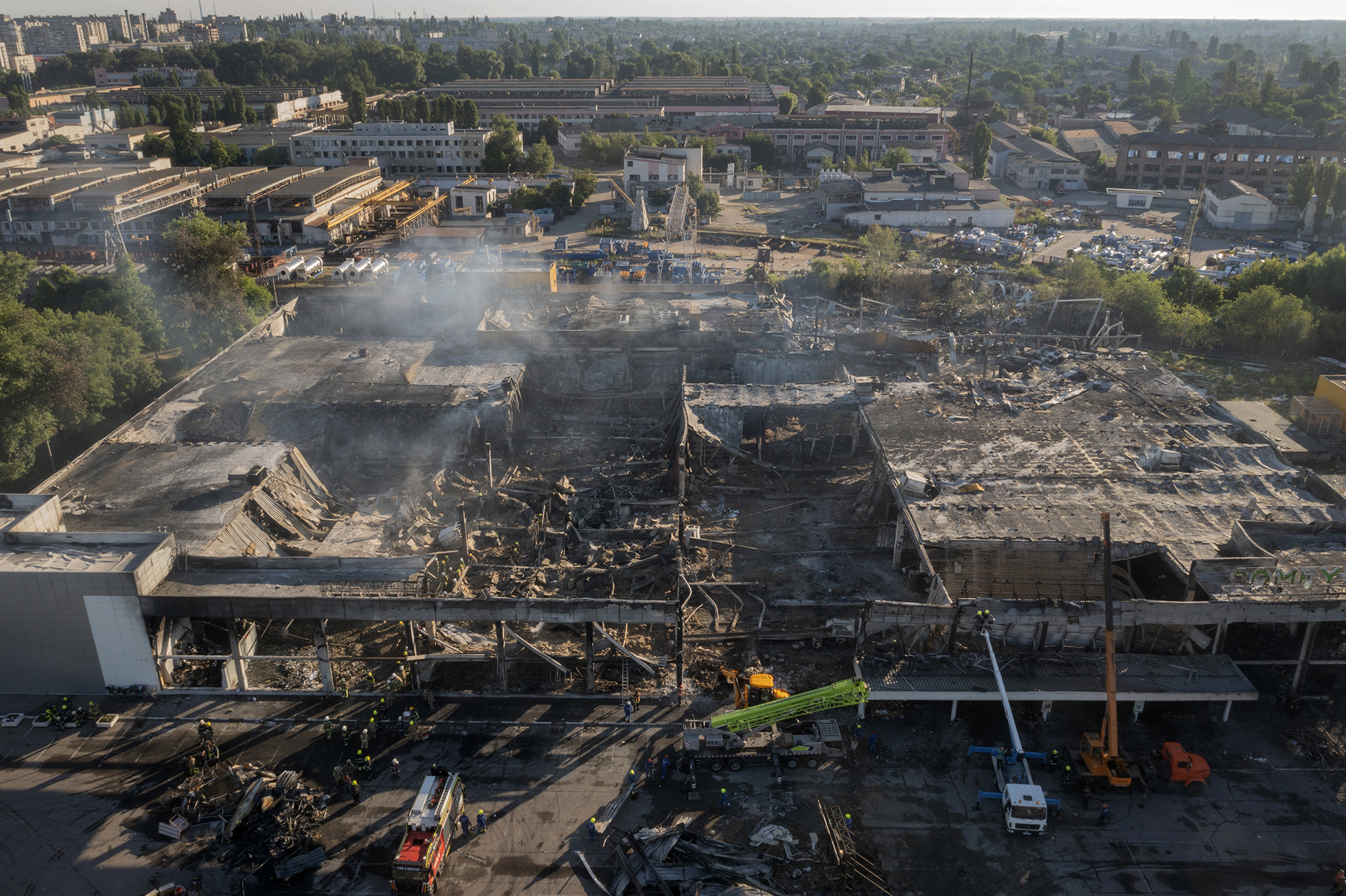 Emergency services attend the shopping mall in Kremenchuk, Ukraine, that was hit by a Russian air strike, June 28.