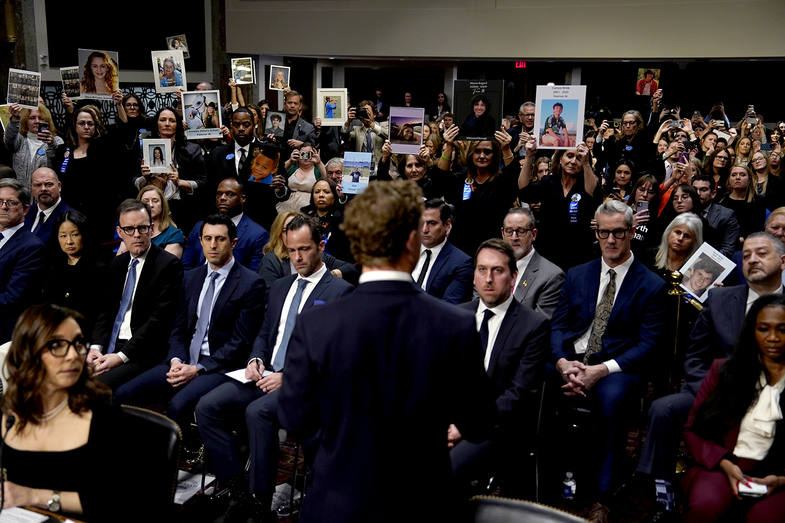 Mark Zuckerberg, center, addresses the audience during a Senate Judiciary Committee hearing in Washington, DC, today.