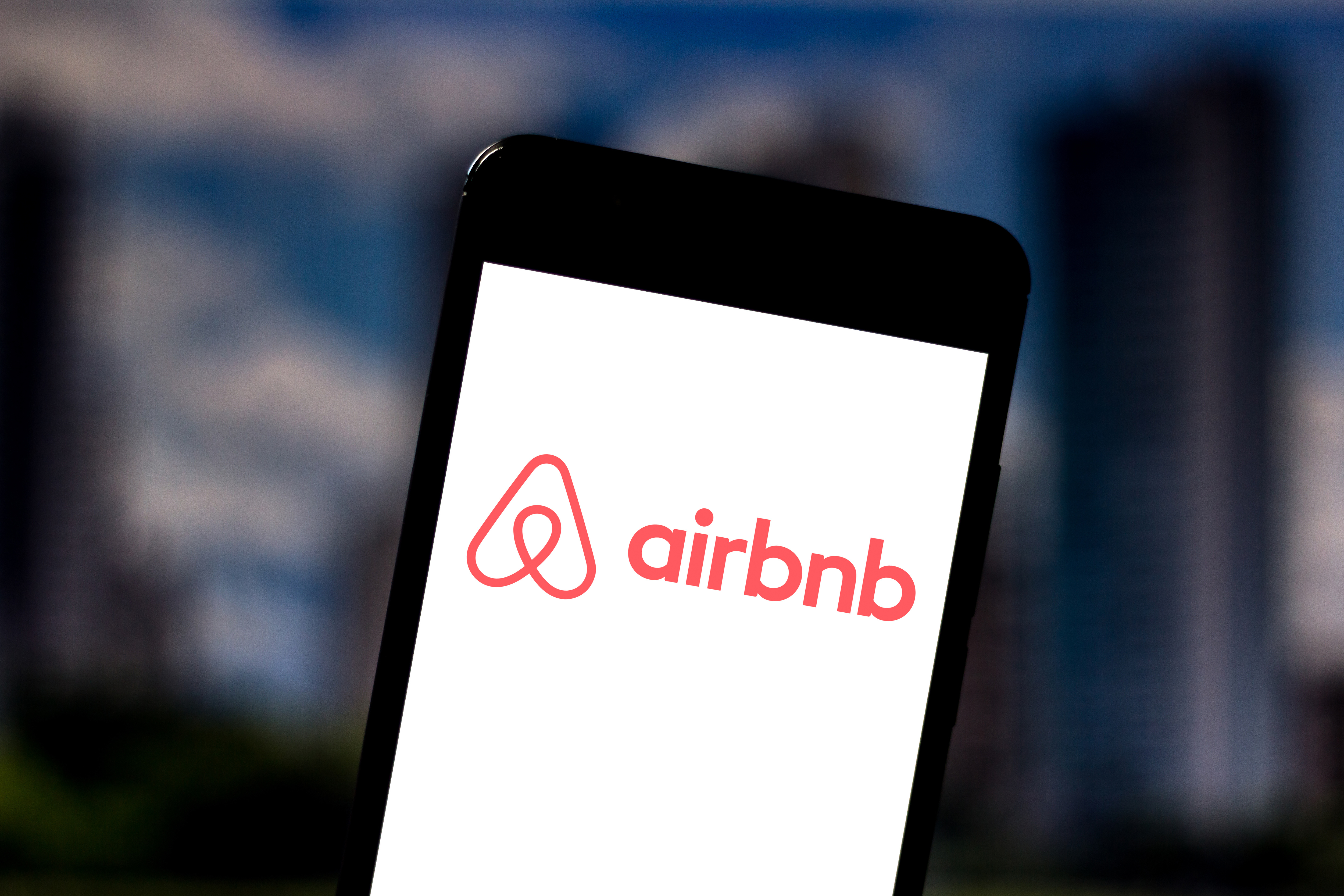 The Airbnb logo is seen displayed on a smartphone on May 24, 2019. 