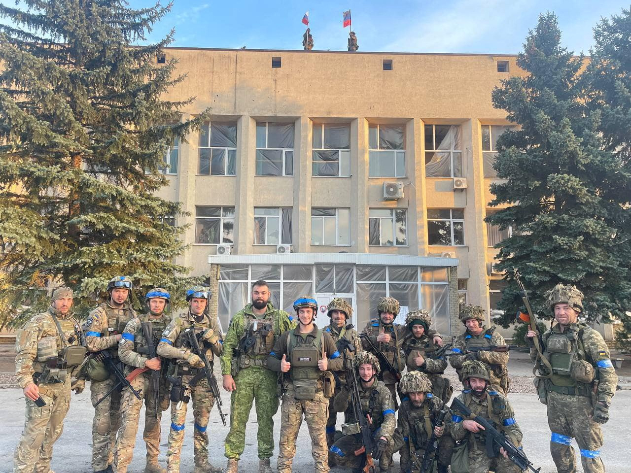 Ukrainian troops pose for a photo in Lyman, Ukraine, in this picture released in social media October 1.