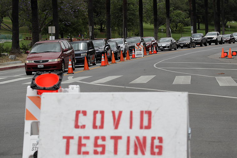 Motorists line up at a coronavirus testing site at Dodger Stadium Monday, June 29, 2020, in Los Angeles. (AP Photo/Marcio Jose Sanchez)