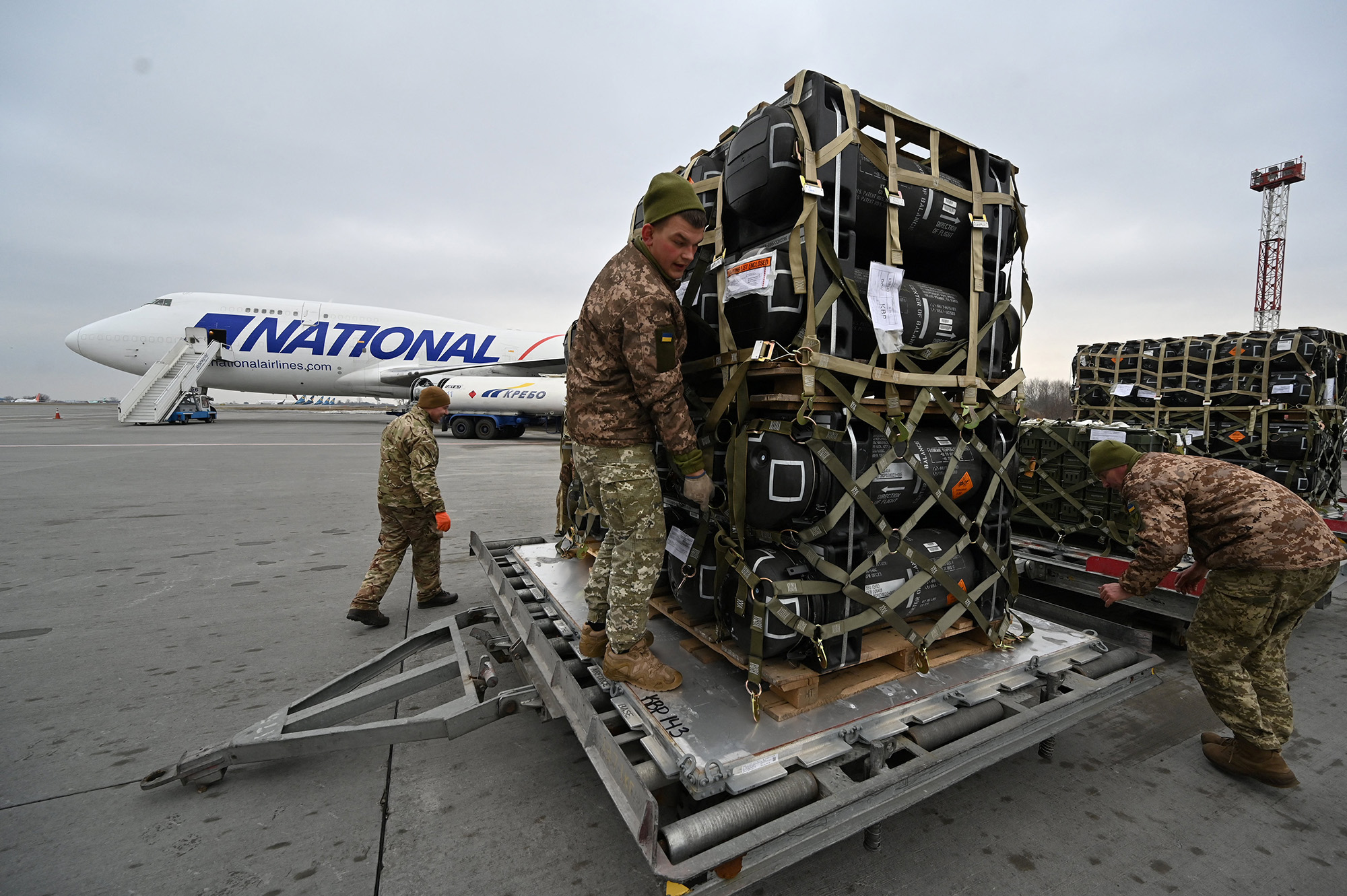 Ukrainian servicemen take delivery of FGM-148 Javelins, anti-tank missiles provided by the United States, at Kyiv's Boryspil airport on February 11.