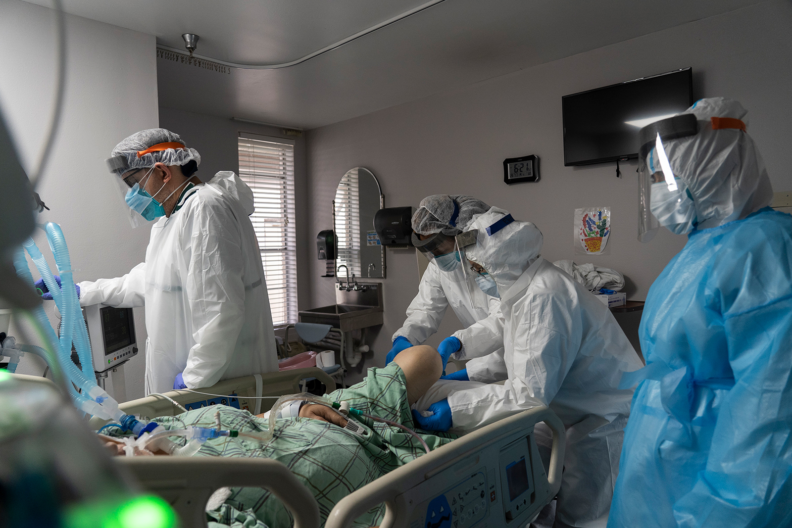 Members of the medical staff treat a patient in the Covid-19 intensive care unit at the United Memorial Medical Center in Houston, Texas, on July 28.