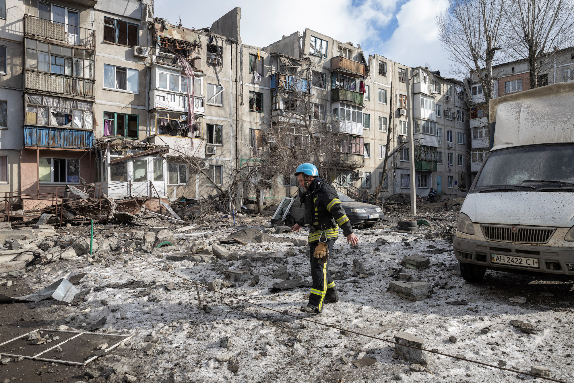 A firefighter walks by an apartment block that was heavily damaged by a missile strike in Pokrovsk on Wednesday.