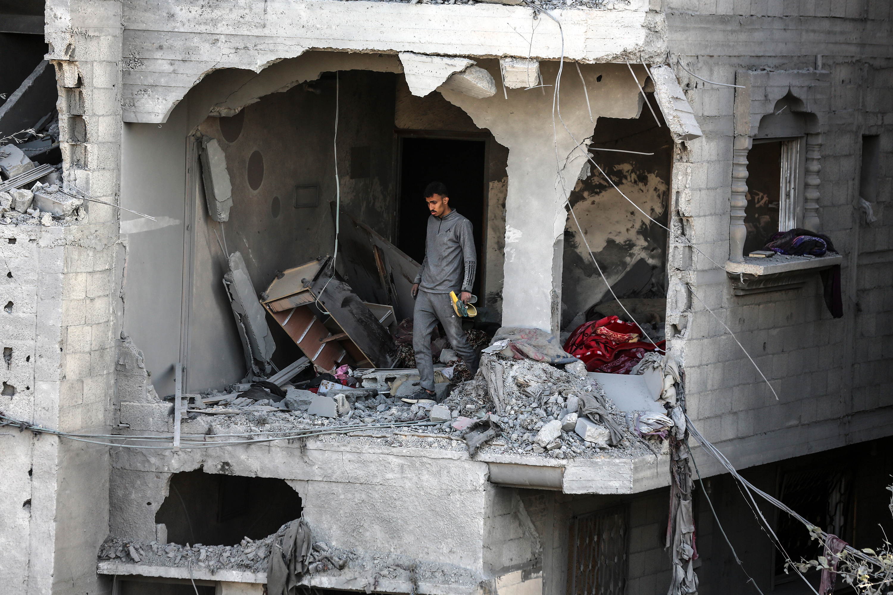 Palestinians inspect the debris of a house destroyed by Israeli shelling in Deir al-Balah, Gaza, on March 4.