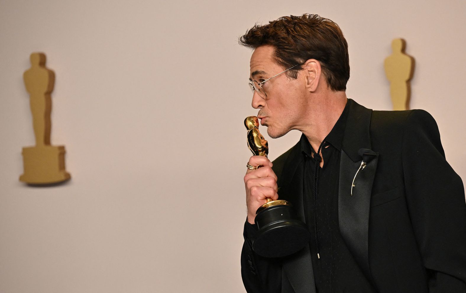Robert Downey Jr. poses in the press room with the Oscar he won for best supporting actor. "I'd like to thank my terrible childhood and the Academy," he said in his acceptance speech. "In that order." 