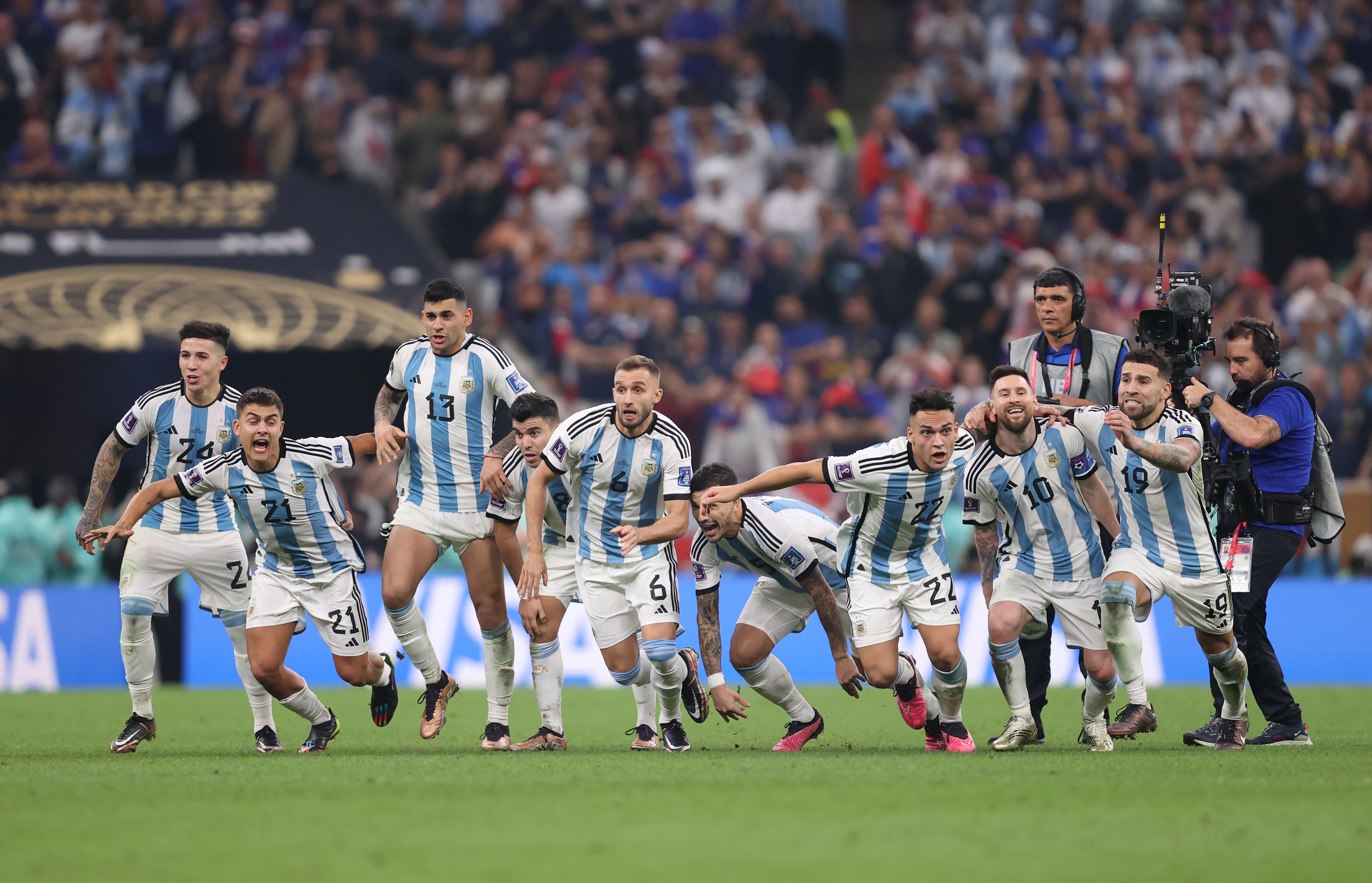 Argentina players celebrate after Gonzalo Montiel scored the tournament-winning penalty in the shootout.