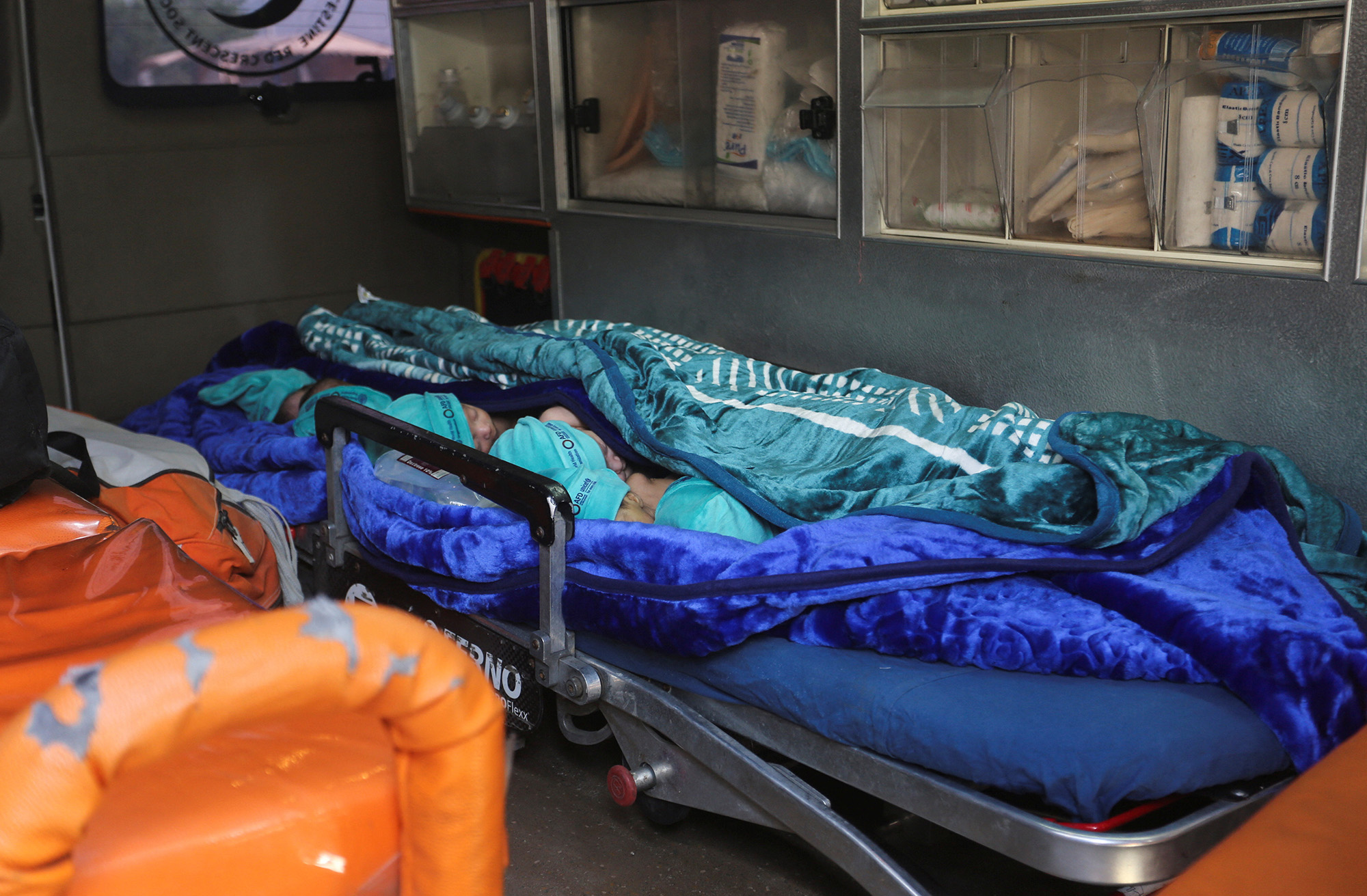 Premature babies, who were evacuated from Al-Shifa hospital, lie in an ambulance before they are transported via the Rafah crossing into Egypt on November 20.