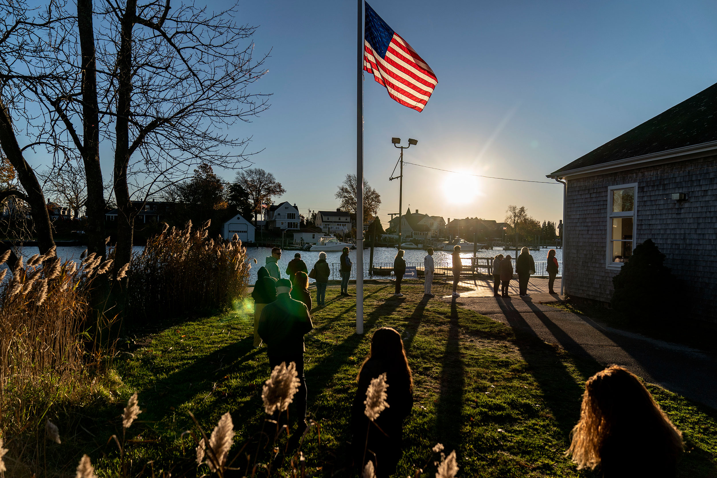 Voters line up to cast their ballots at the Aspray Boat House in Warwick, Rhode Island, Tuesday.