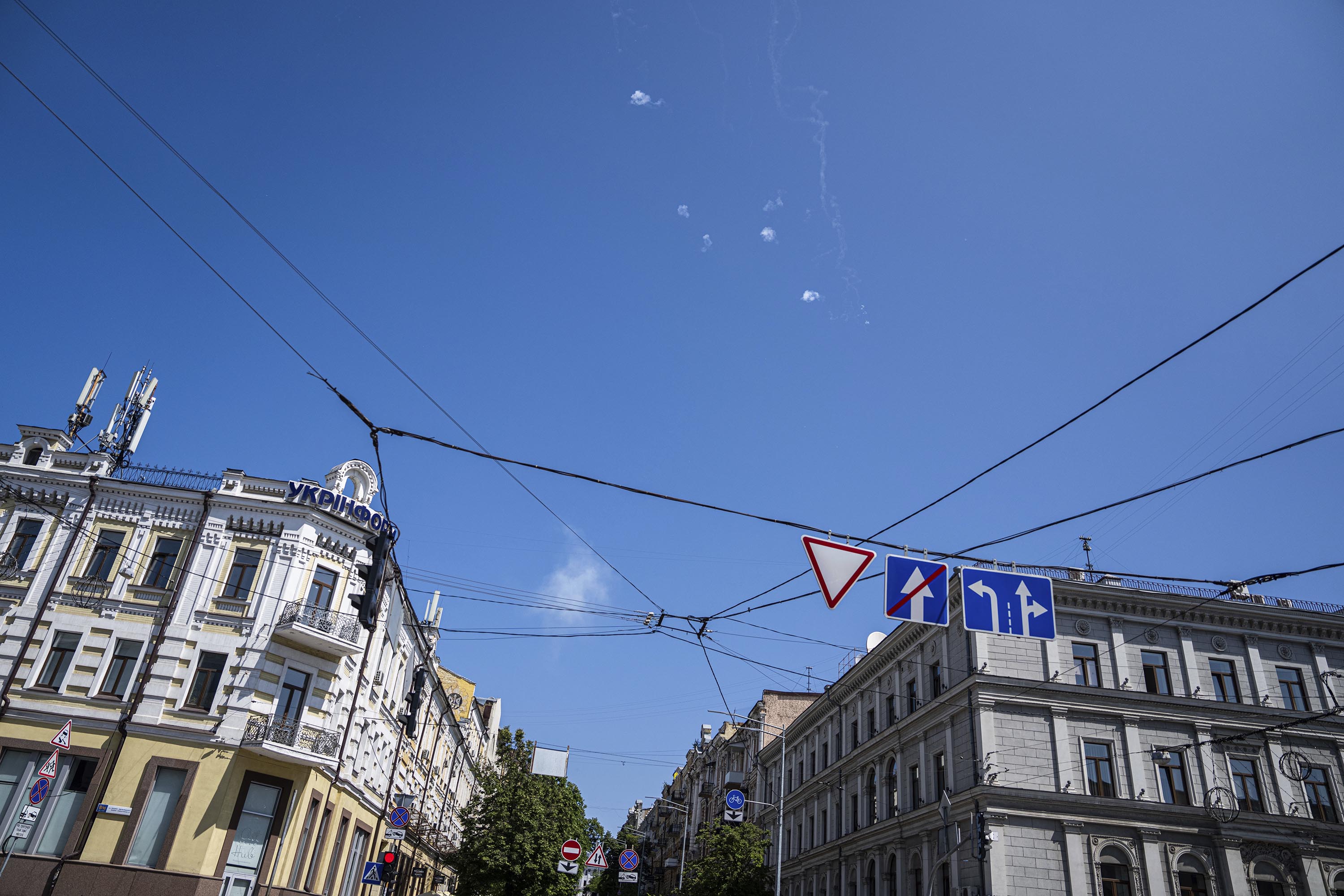 Tracks and white smoke are seen in the sky during a Russian rocket attack in Kyiv, Ukraine, on Monday, May 29. 
