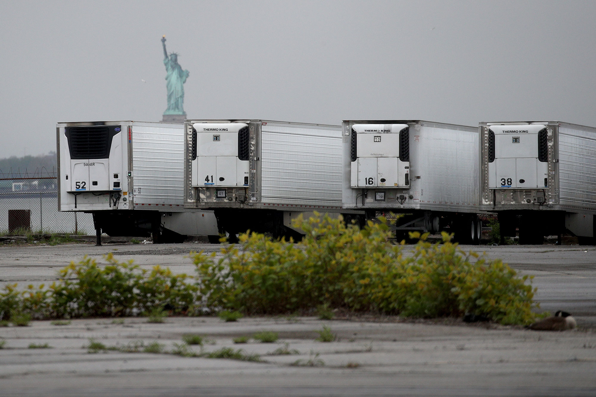 Refrigerated trucks functioning as temporary morgues are seen at the South Brooklyn Marine Terminal on May 6 in the Brooklyn borough of New York City. 