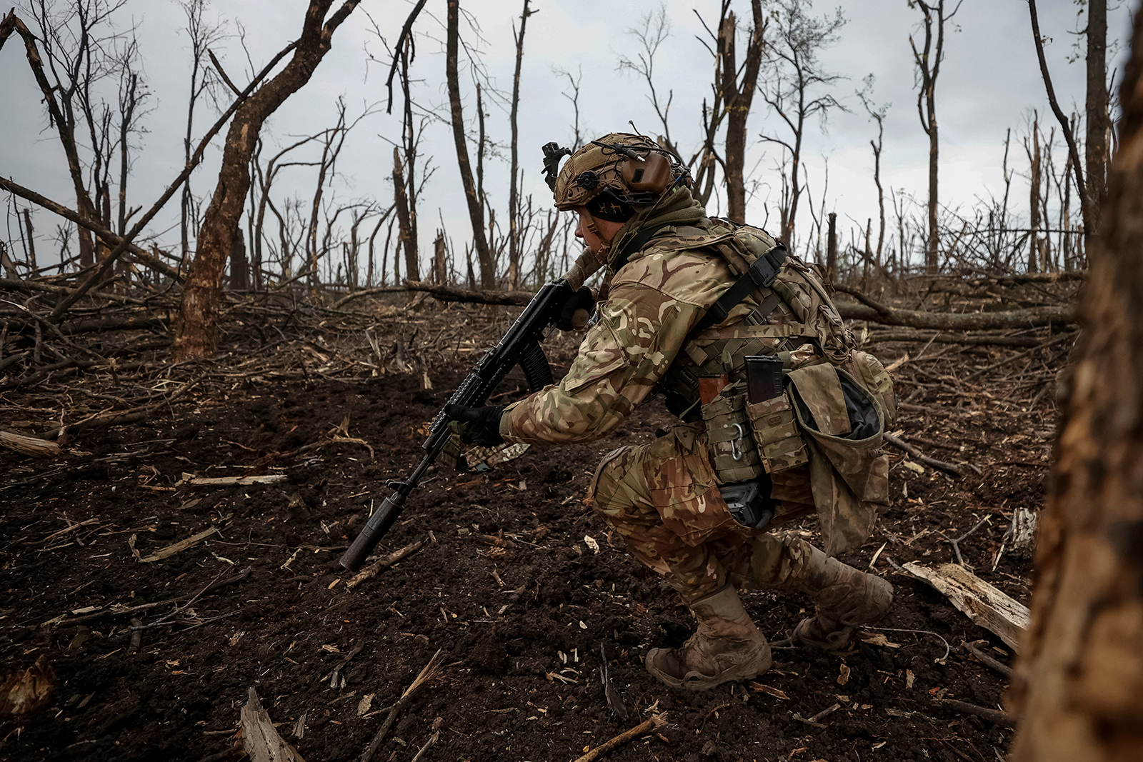A Ukrainian serviceman checks Russian positions after a fight near the front line city of Bakhmut, in Donetsk region, Ukraine on May 11.
