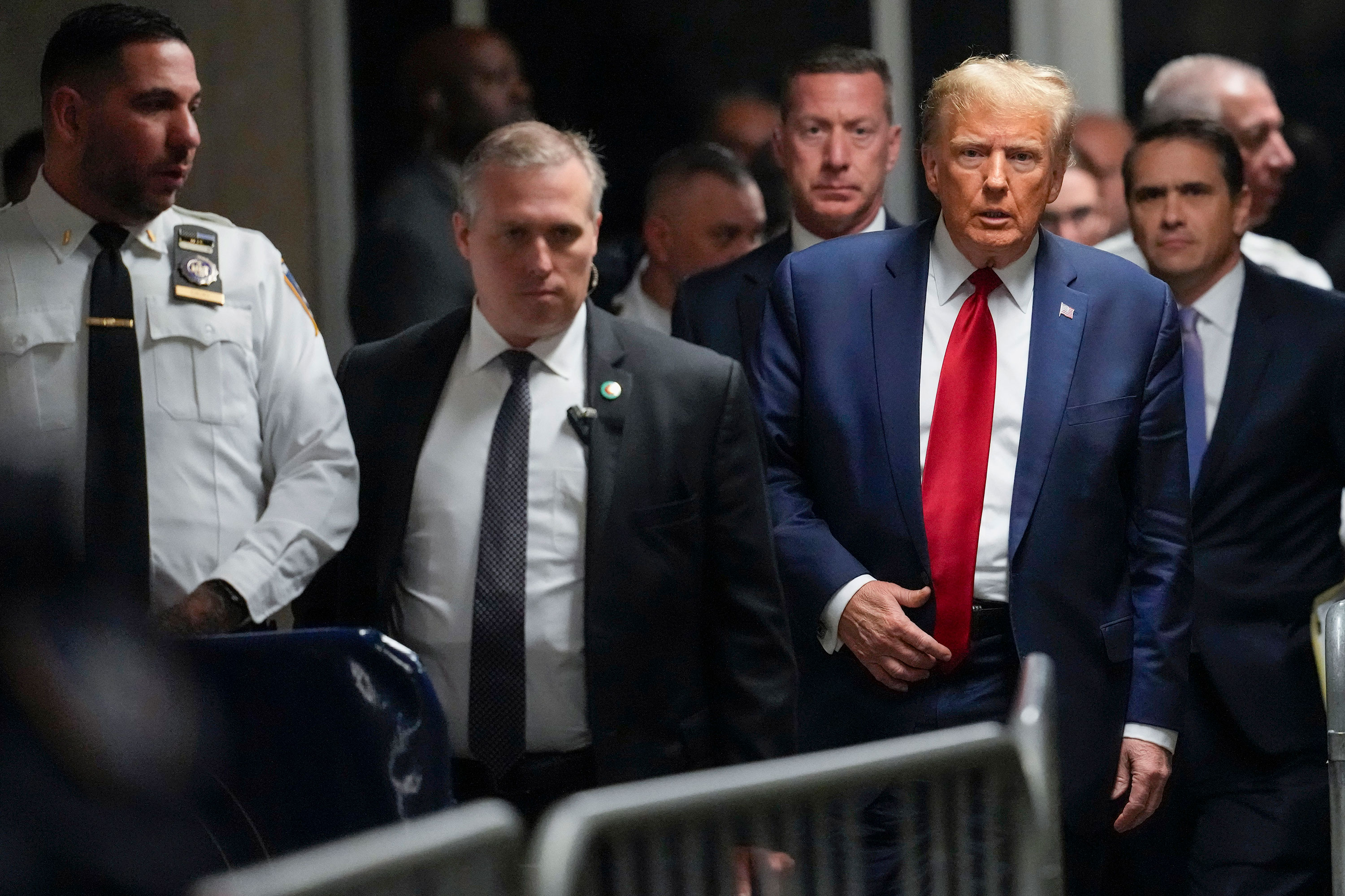 Former President Donald Trump leaves a Manhattan criminal court in February.