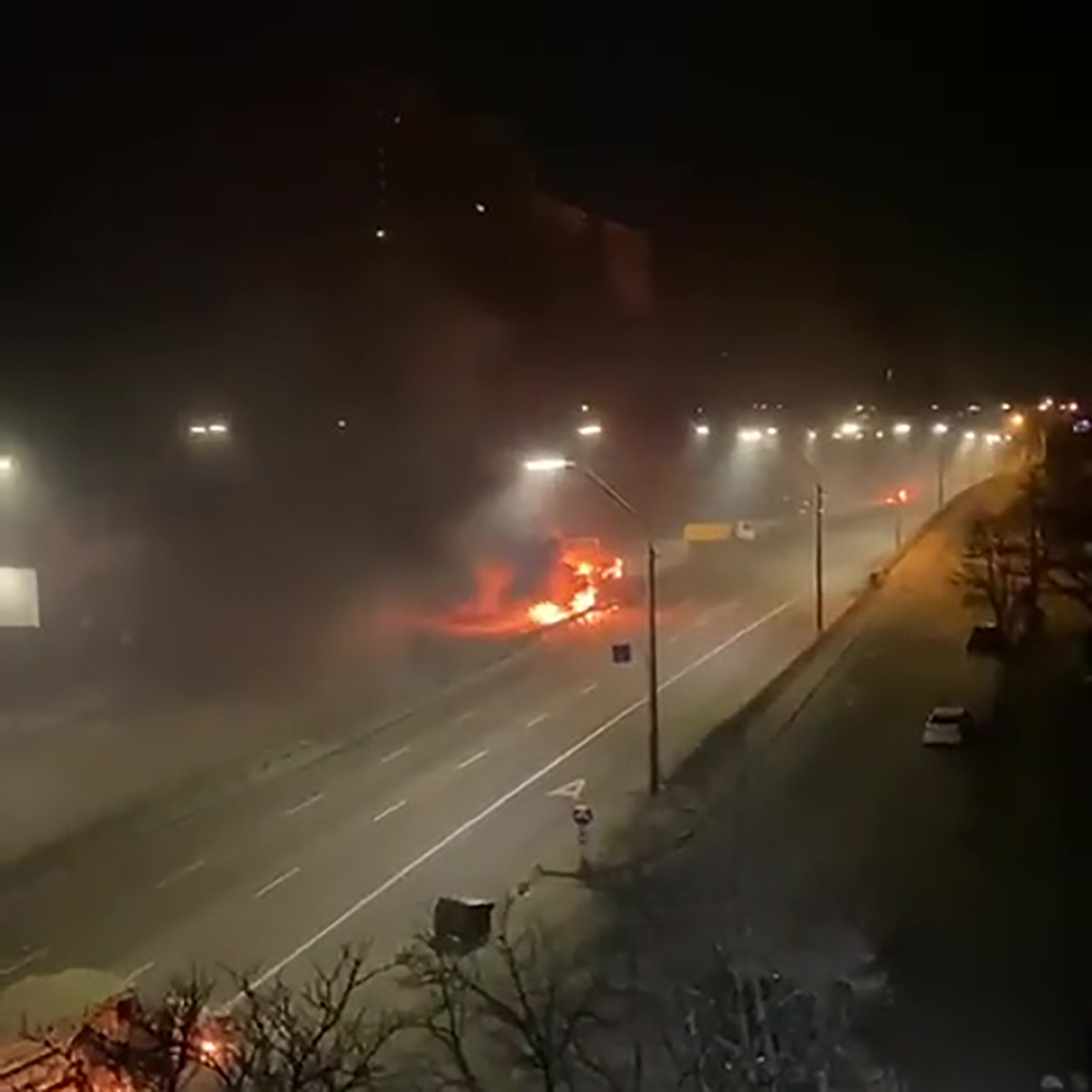 A fire is seen on Peremohy Avenue, in Kyiv, near the Beresteiska metro station.
