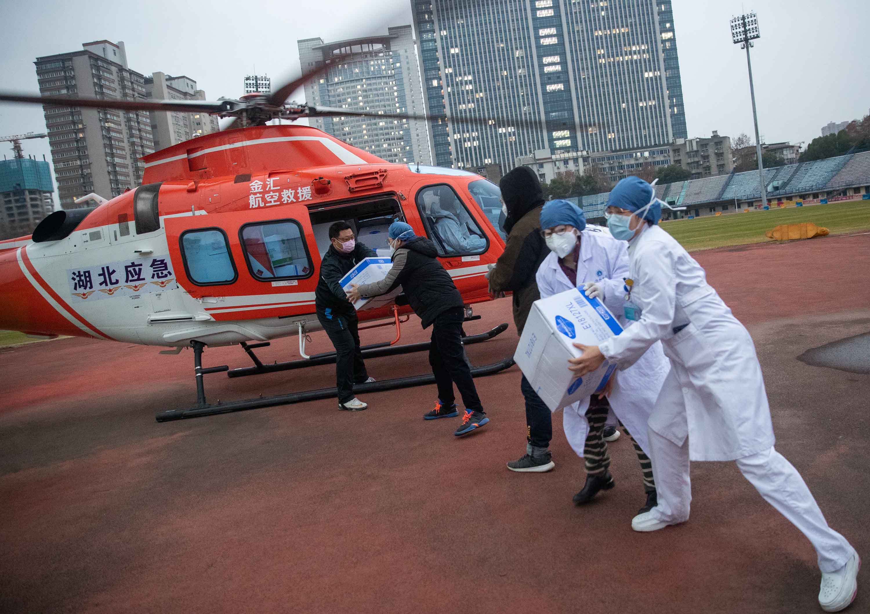 Medical staff unload supplies from a helicopter in Wuhan on February 1.