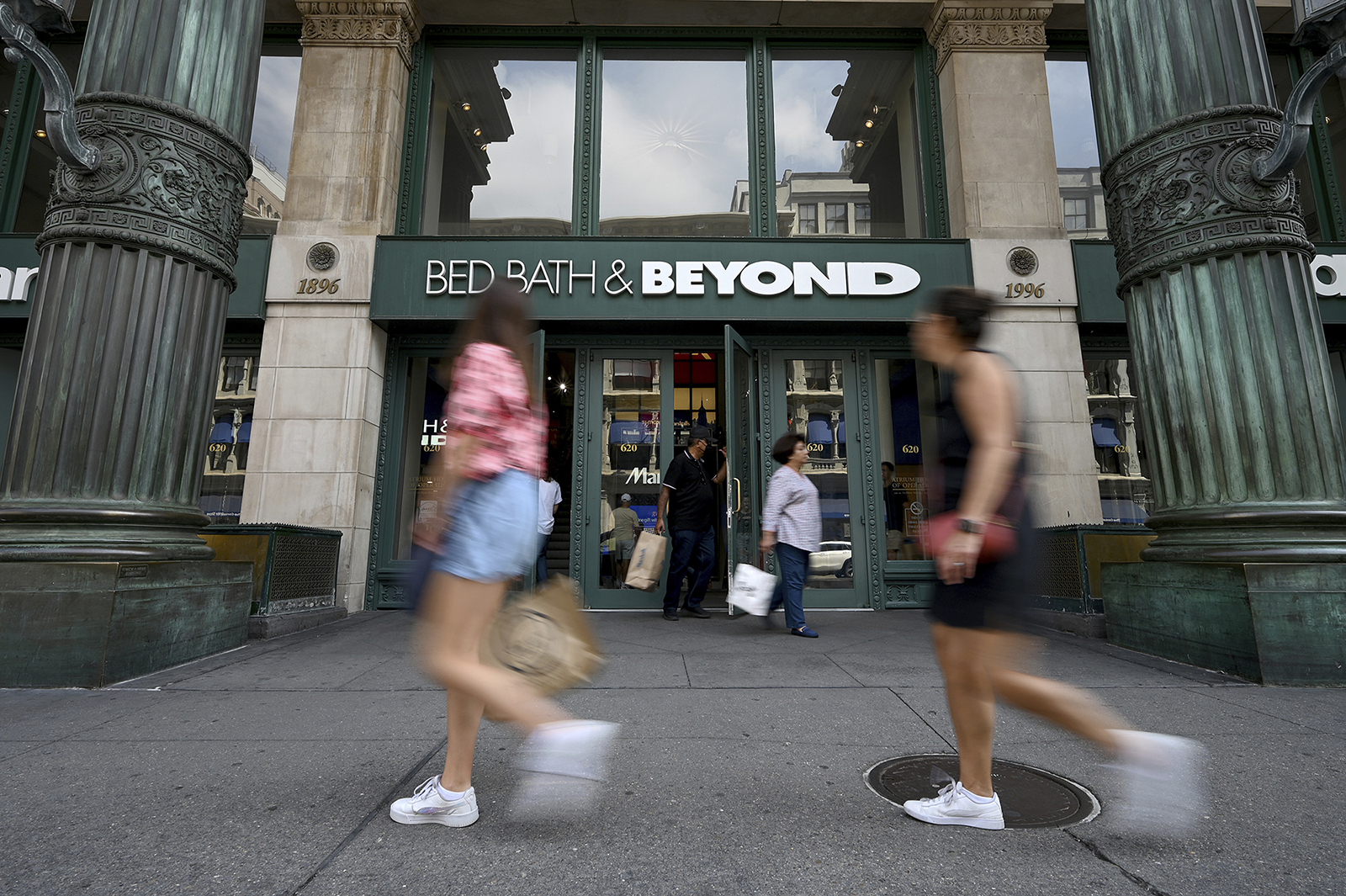 People walk past the entrance to a Bed Bath & Beyond retail store along Sixth Avenue in New York, on September 4, 2022. 