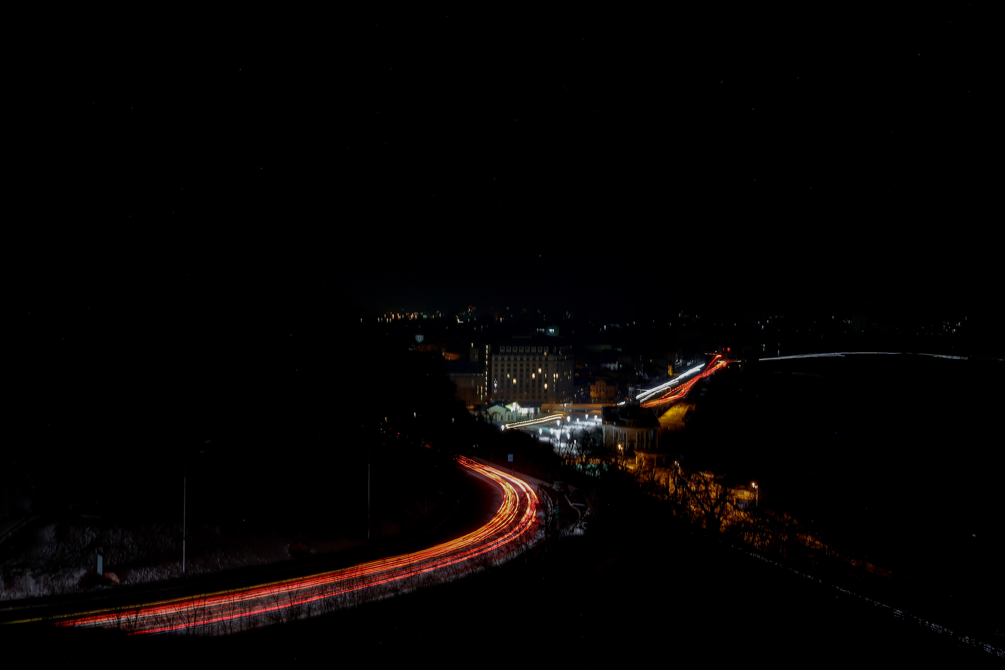 A long-exposure photo shows a view of a road in Kyiv during a power outage on Monday.