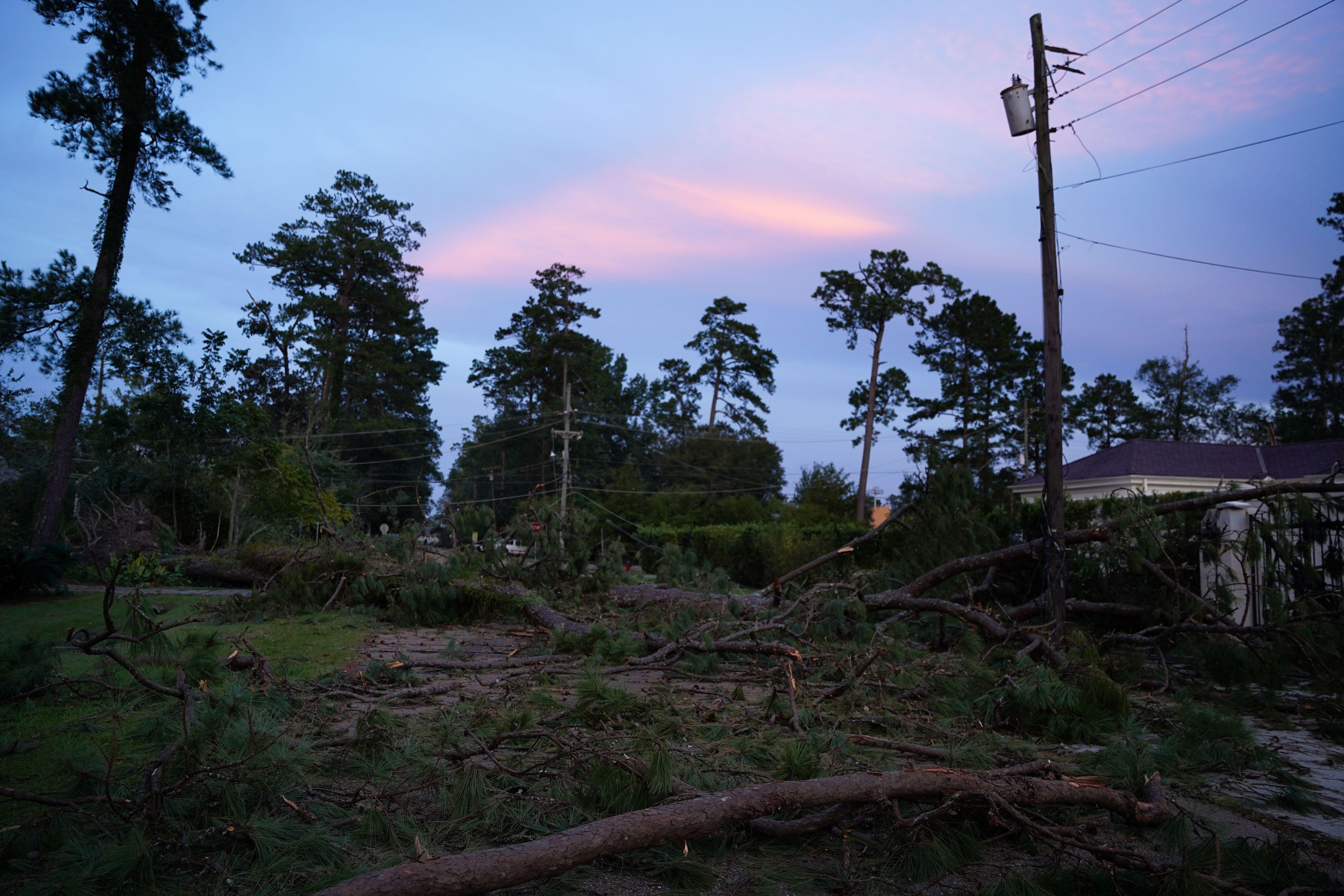 A storm-damaged neighborhood in Covington, Louisiana, is pictured during sunset on August 31.