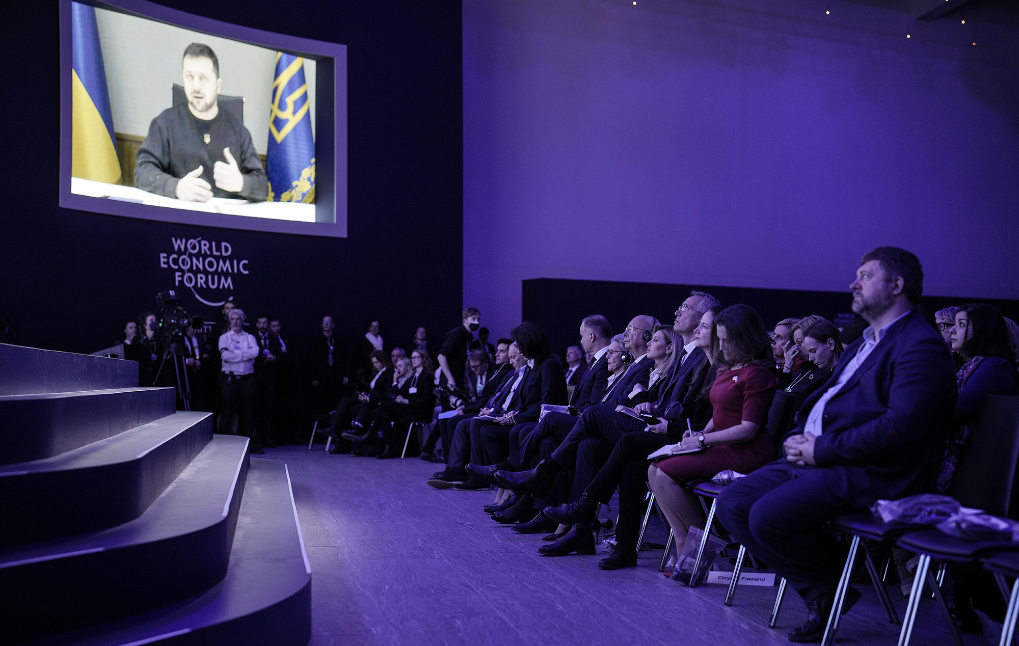 President Volodymyr Zelensky of Ukraine talks from a video screen to participants at the World Economic Forum in Davos, Switzerland, on January 18.