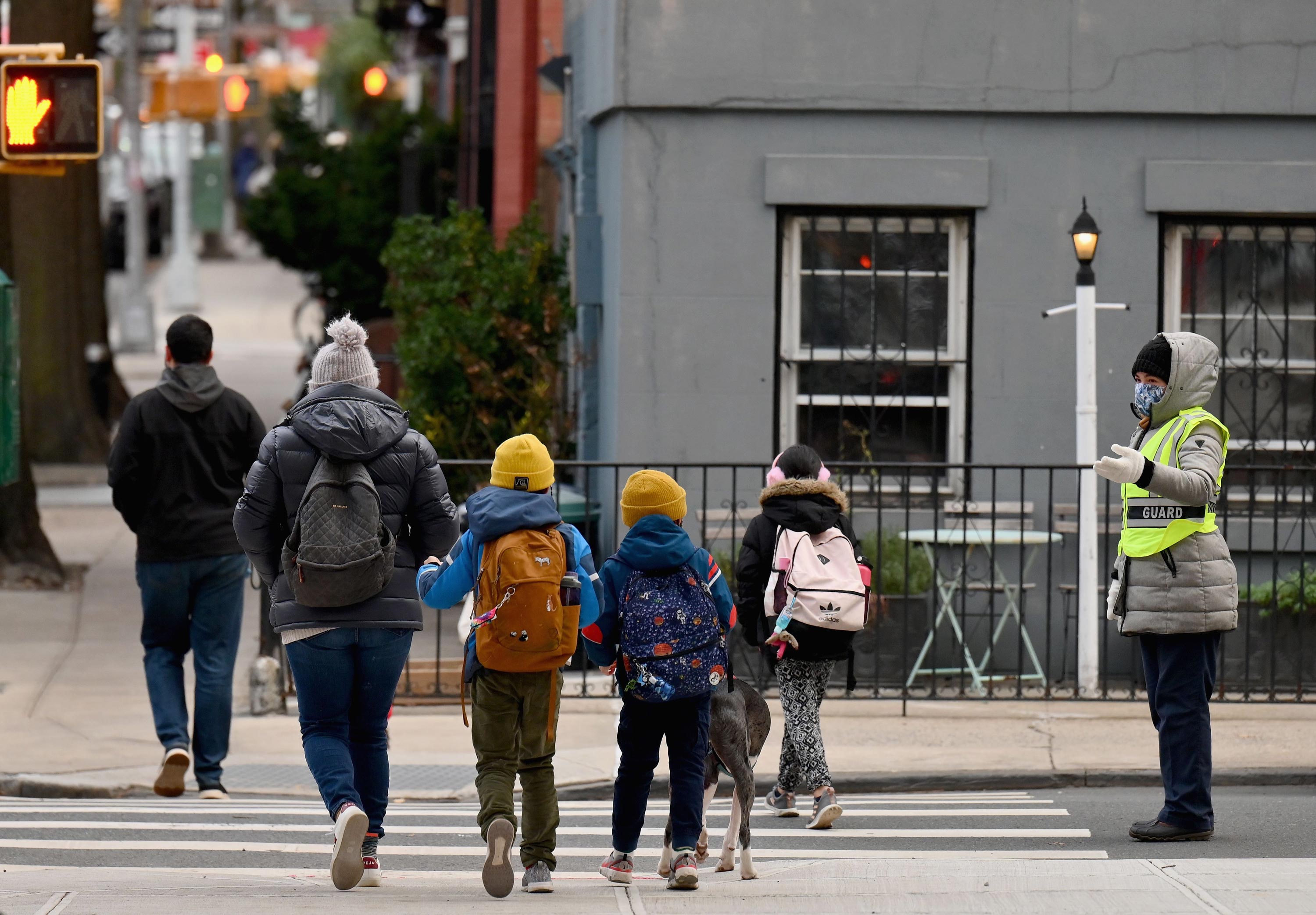 Children arrive for class on December 7, 2020, in New York City. 