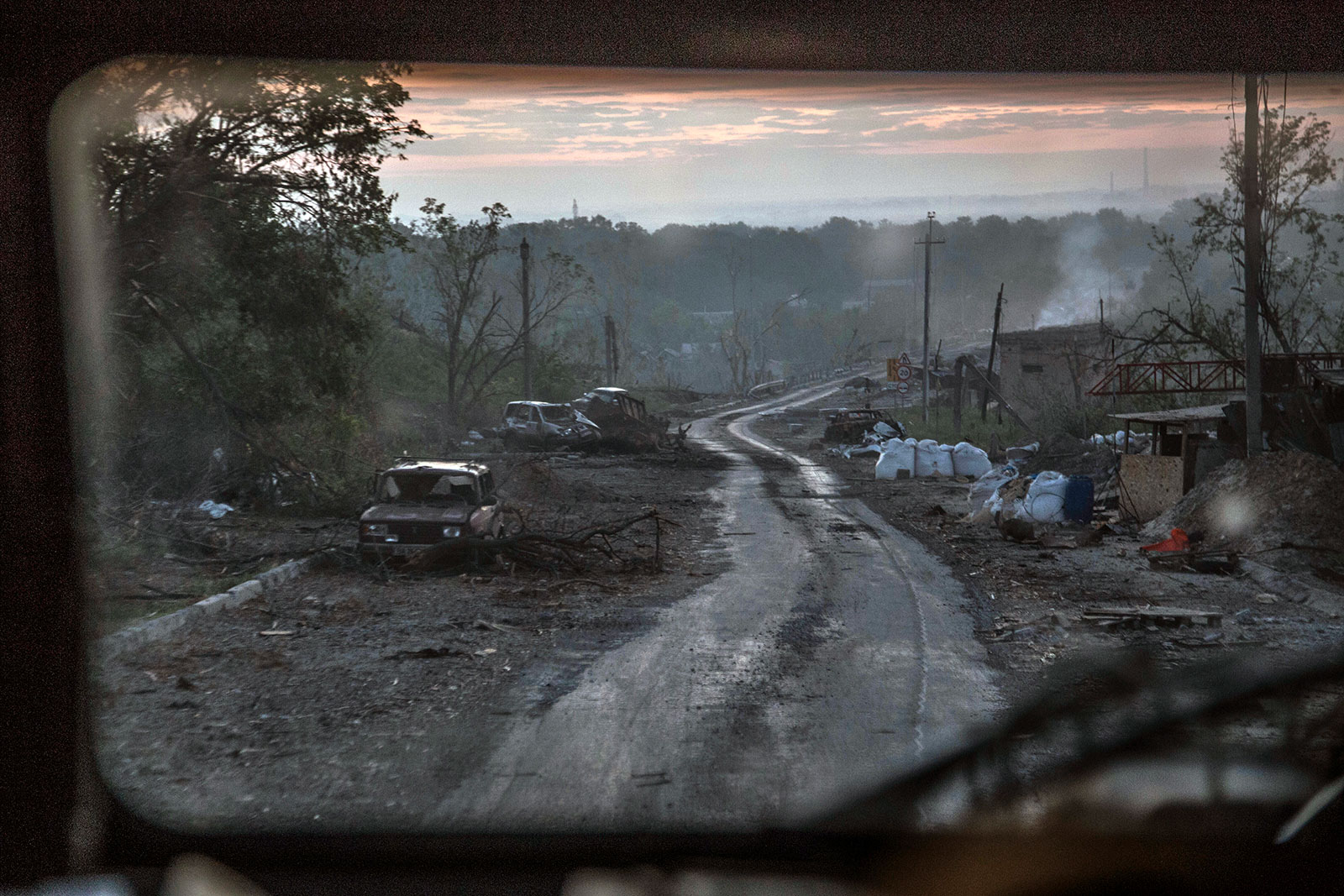 The gutted remains of cars sit along a road during heavy fighting in Severodonetsk on June 8. 