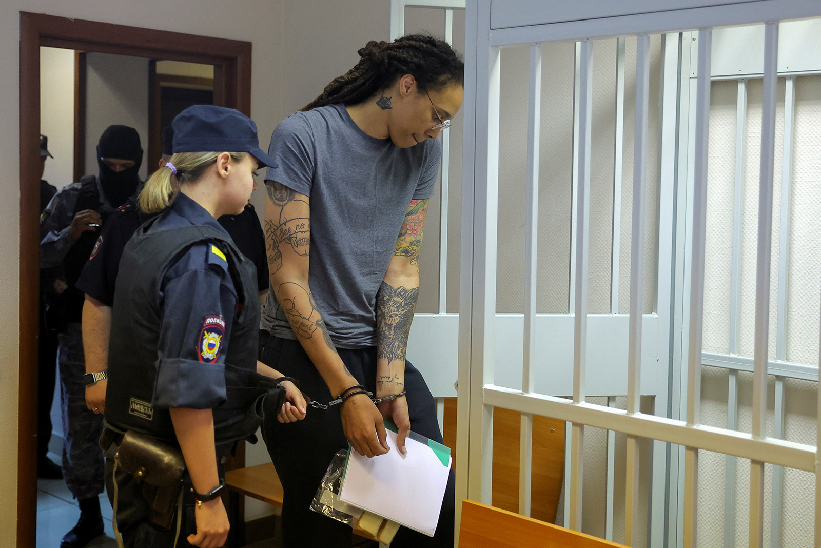 U.S. basketball player Brittney Griner is escorted before a court hearing in Khimki outside Moscow, Russia, on August 4.