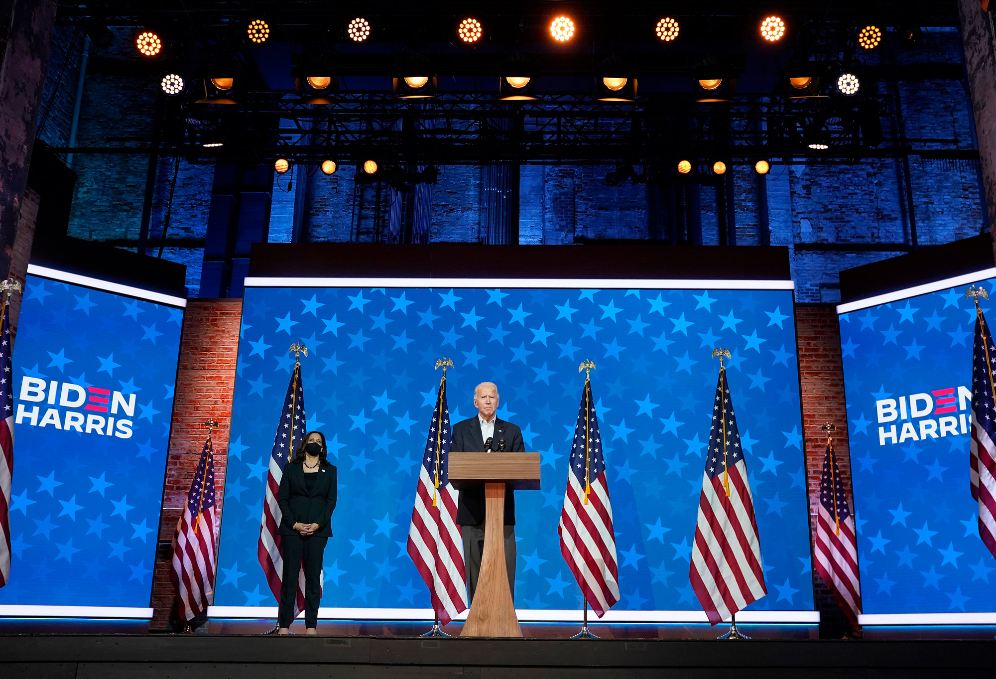 Democratic presidential nominee Joe Biden speaks while flanked by vice presidential nominee, Sen. Kamala Harris, at The Queen theater on November 5 in Wilmington, Delaware.