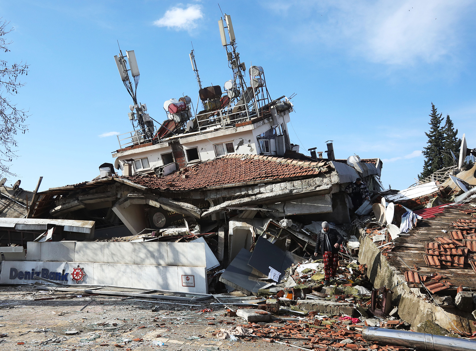 A man walks through the wreckage of a collapsed building in Maras, Turkey, on February 7.