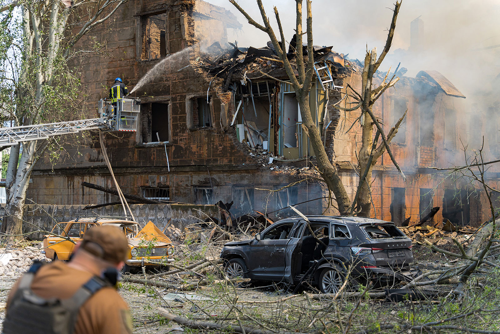 Firefighters extinguish a fire in a hospital building hit by a Russian missile on May 26 in Dnipro, Ukraine.