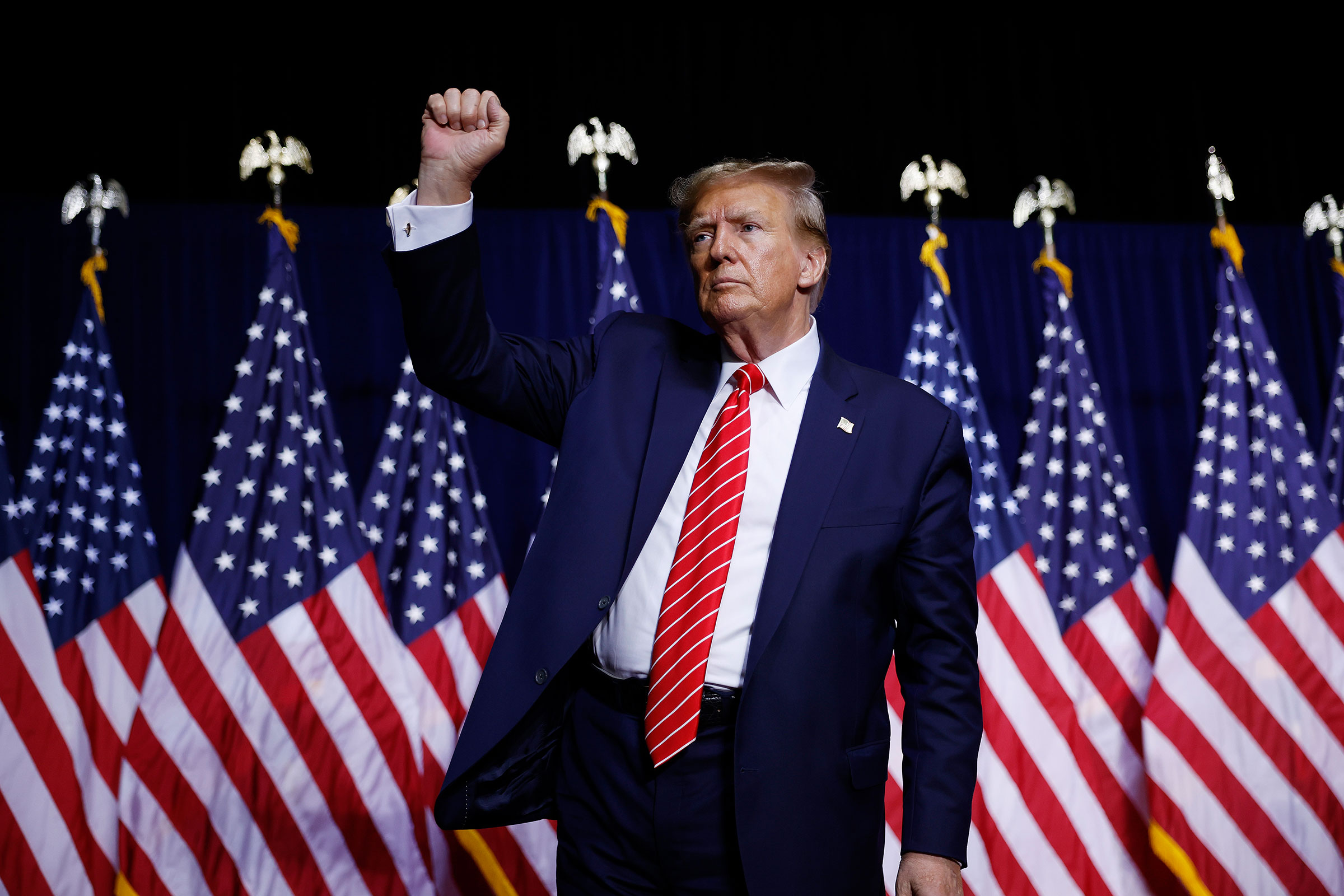 Former President Donald Trump leaves the stage a the conclusion of a campaign rally at the Forum River Center March 9, in Rome, Georgia. 