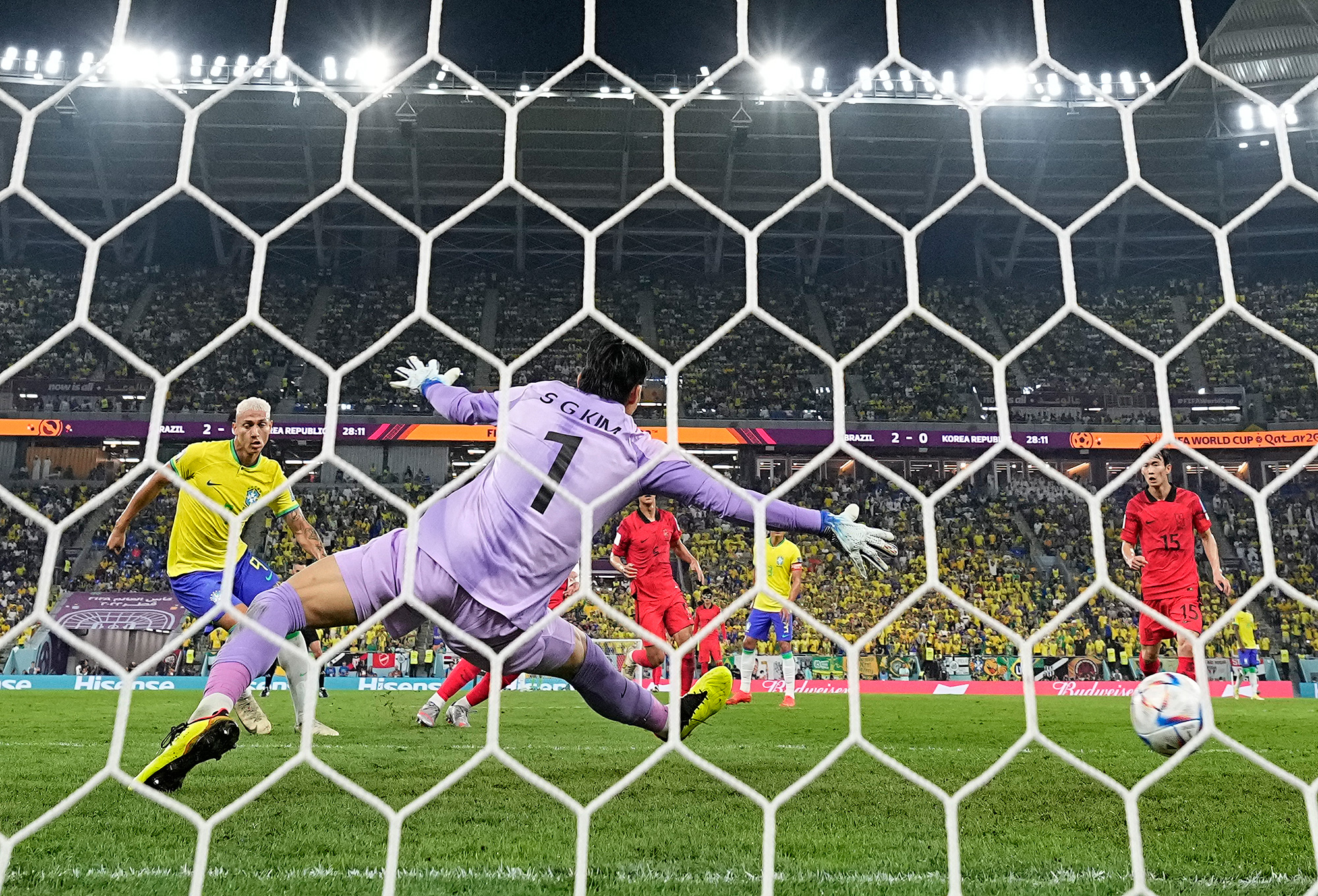 Richarlison scores Brazil's third goal past South Korea's goalkeeper Kim Seung-gyu.