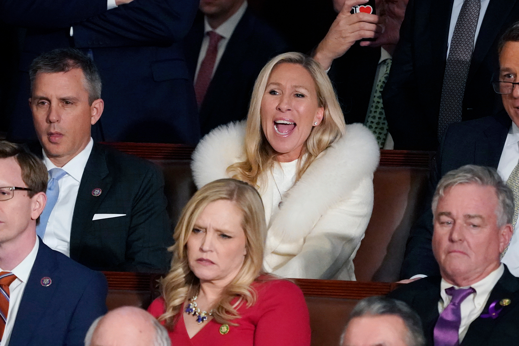 Rep. Majorie Taylor Greene listens and reacts as President Joe Biden delivers his State of the Union speech.