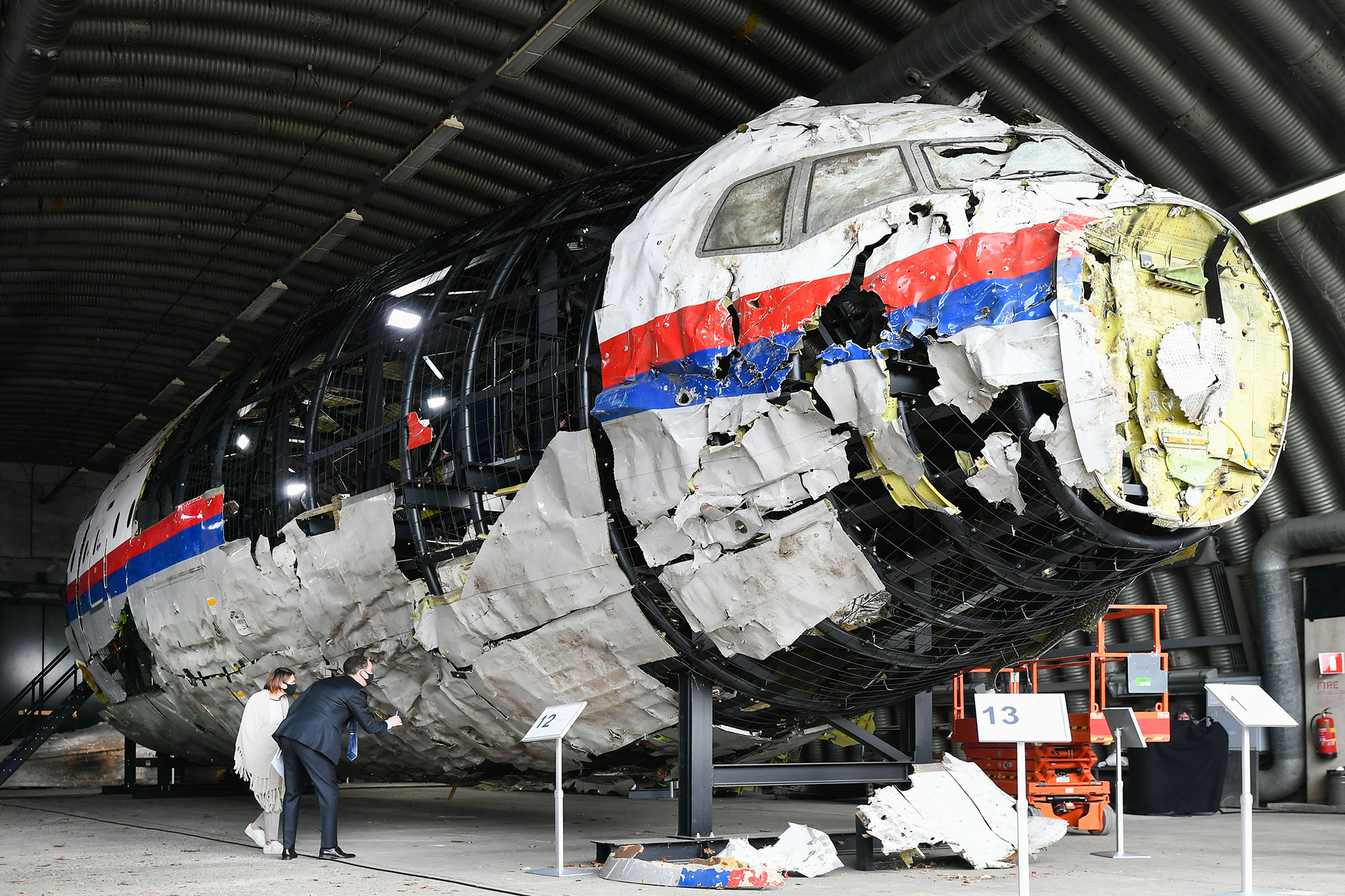 Lawyers attend the judges' inspection of the reconstruction of the MH17 wreckage on May 26, 2021 in Reijen, Netherlands. 