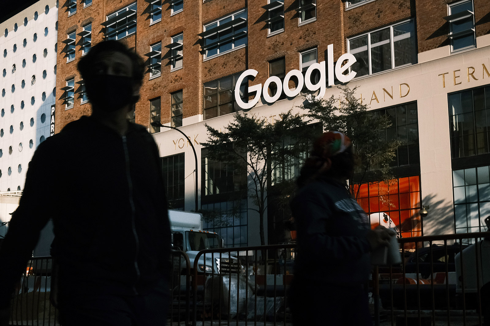 People walk past Google's offices in New York.