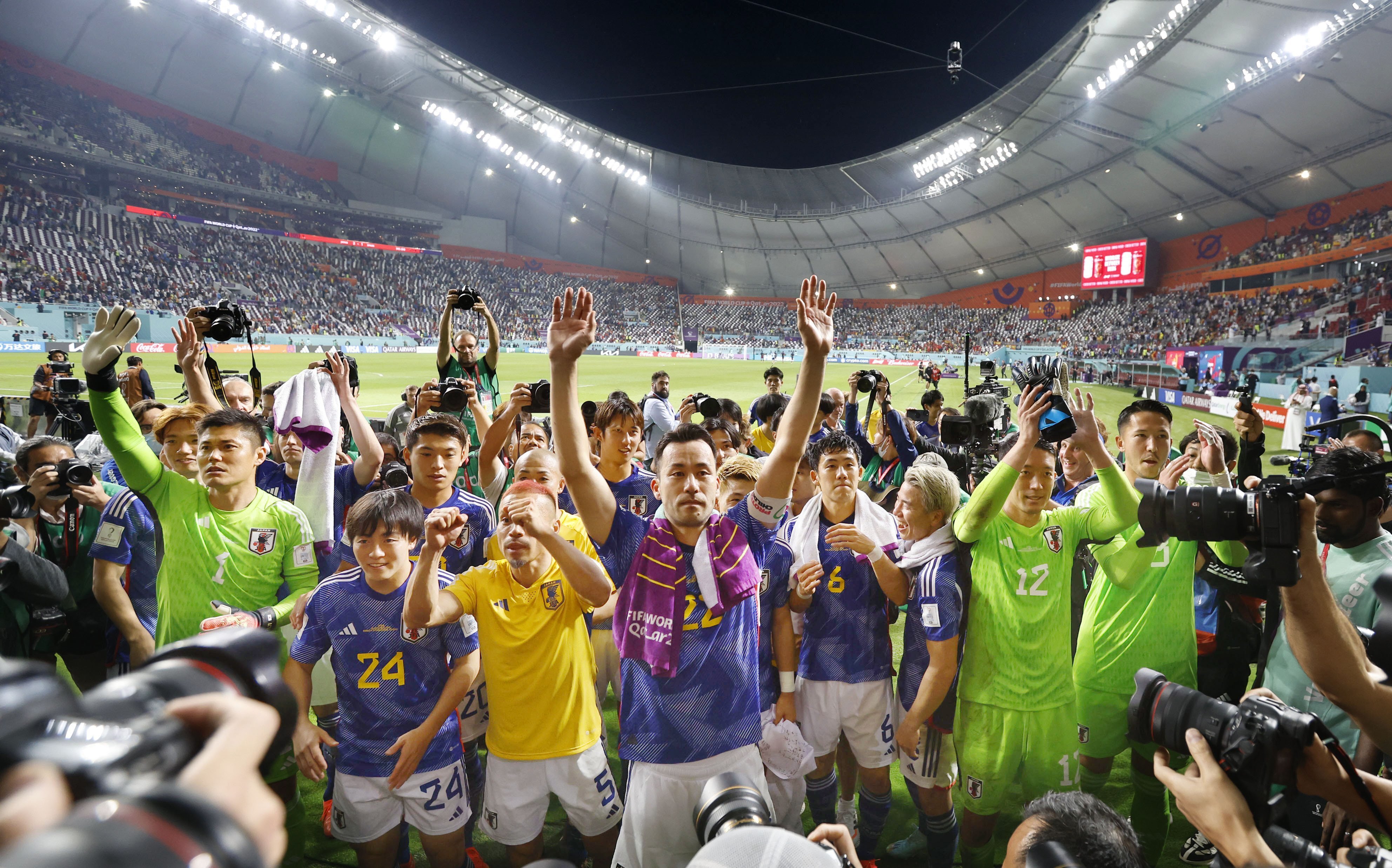 Japan captain Maya Yoshida, center, and his teammates after defeating Spain 2-1 at Khalifa International Stadium in Doha, Qatar on December 2.