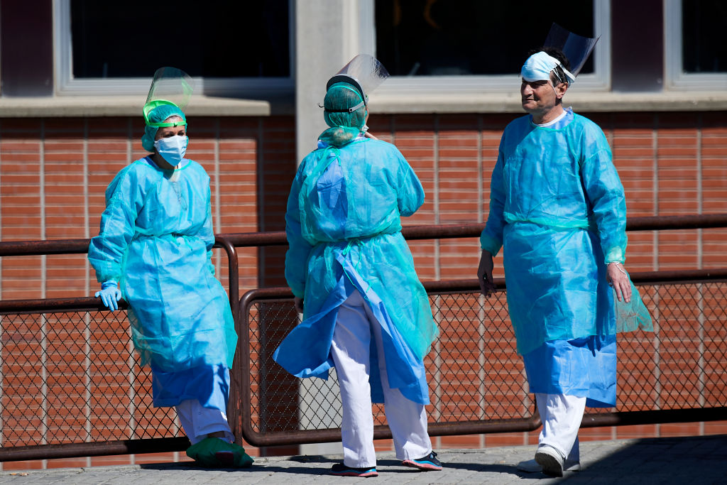 Health personnel outside the emergency entrance of the Severo Ochoa Hospital on March 28, in Madrid, Spain.