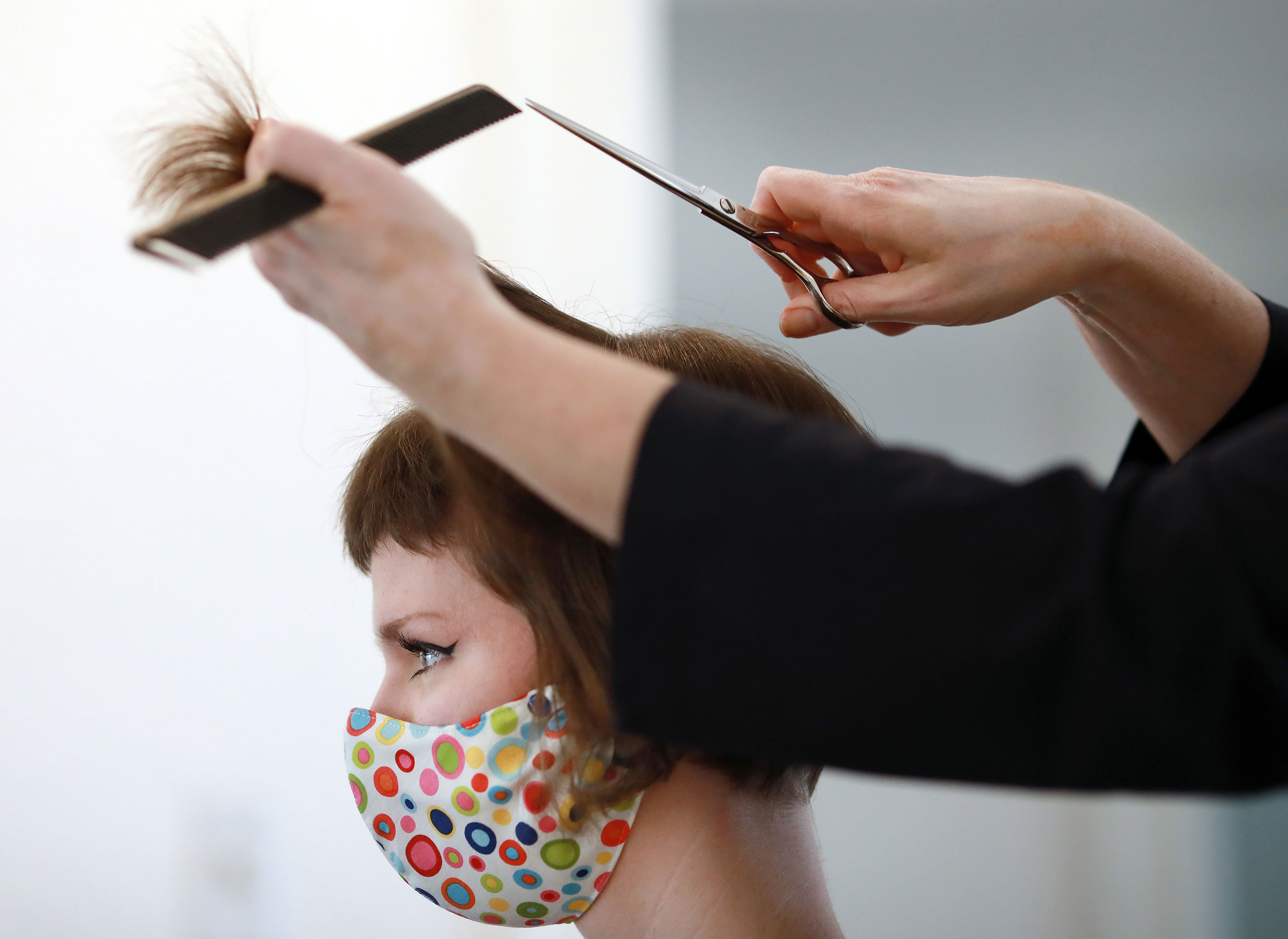A woman sits during a hair-styling appointment in Fort Worth, Texas, on May 8.