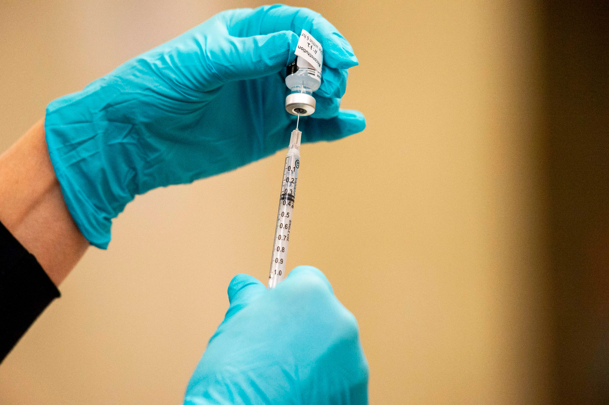 A syringe is filled with the Pfizer BioNTech Covid-19 at Backus Hospital in Norwich, Connecticut, on December 15.