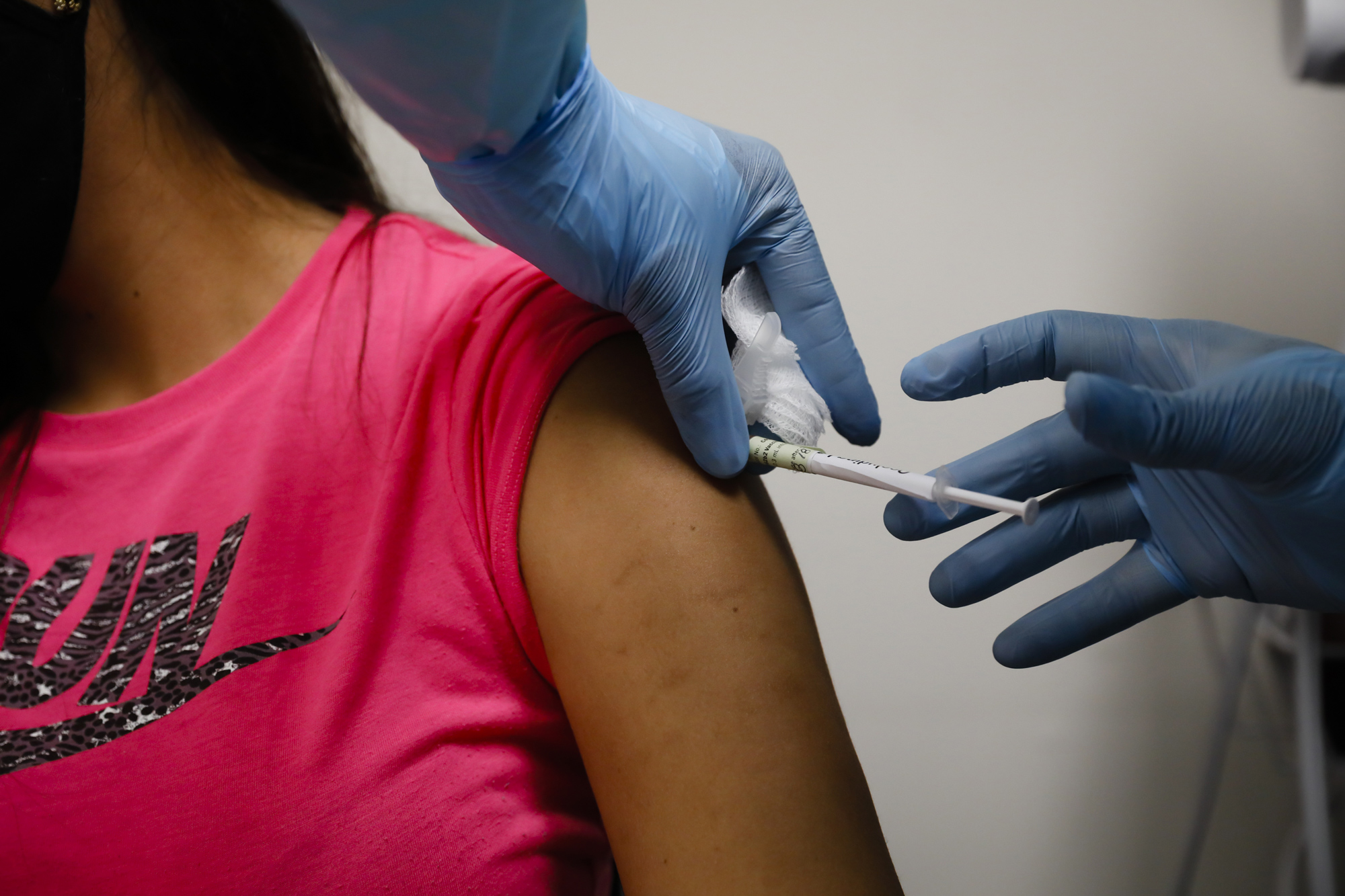A health worker injects a person during clinical trials for a Covid-19 vaccine at Research Centers of America in Hollywood, Florida, on September 9.
