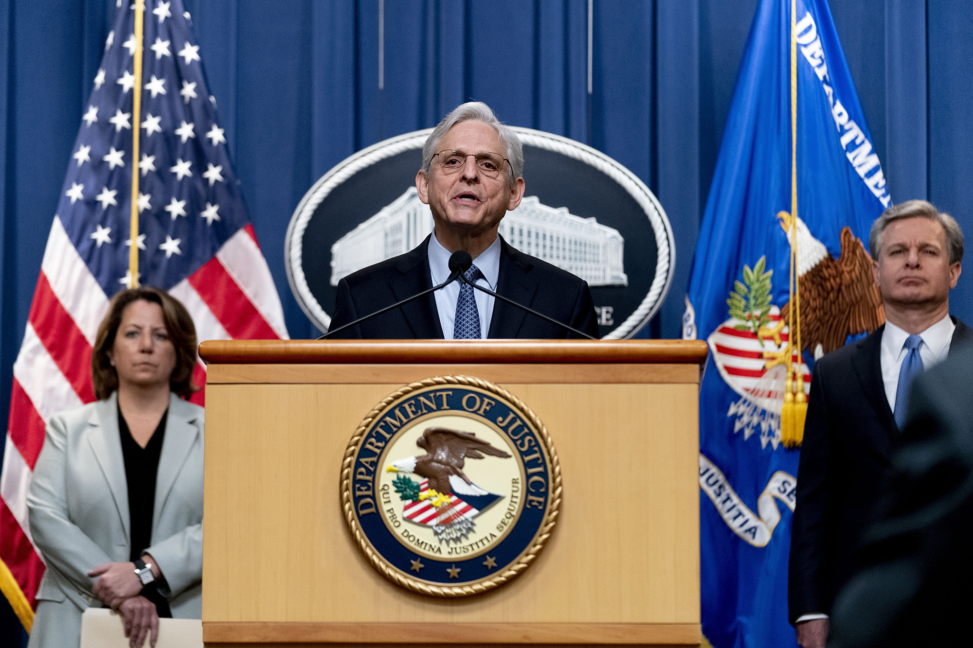Attorney General Merrick Garland, center, accompanied by Deputy Attorney General Lisa Monaco, left, and FBI Director Christopher Wray, right, speaks at a news conference at the Justice Department in Washington D.C, on April 6.