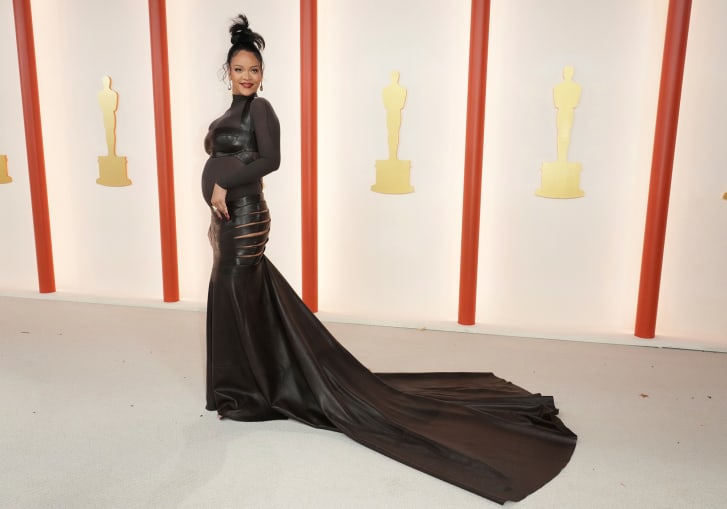 Rihanna walks the red carpet at the Academy Awards. 
