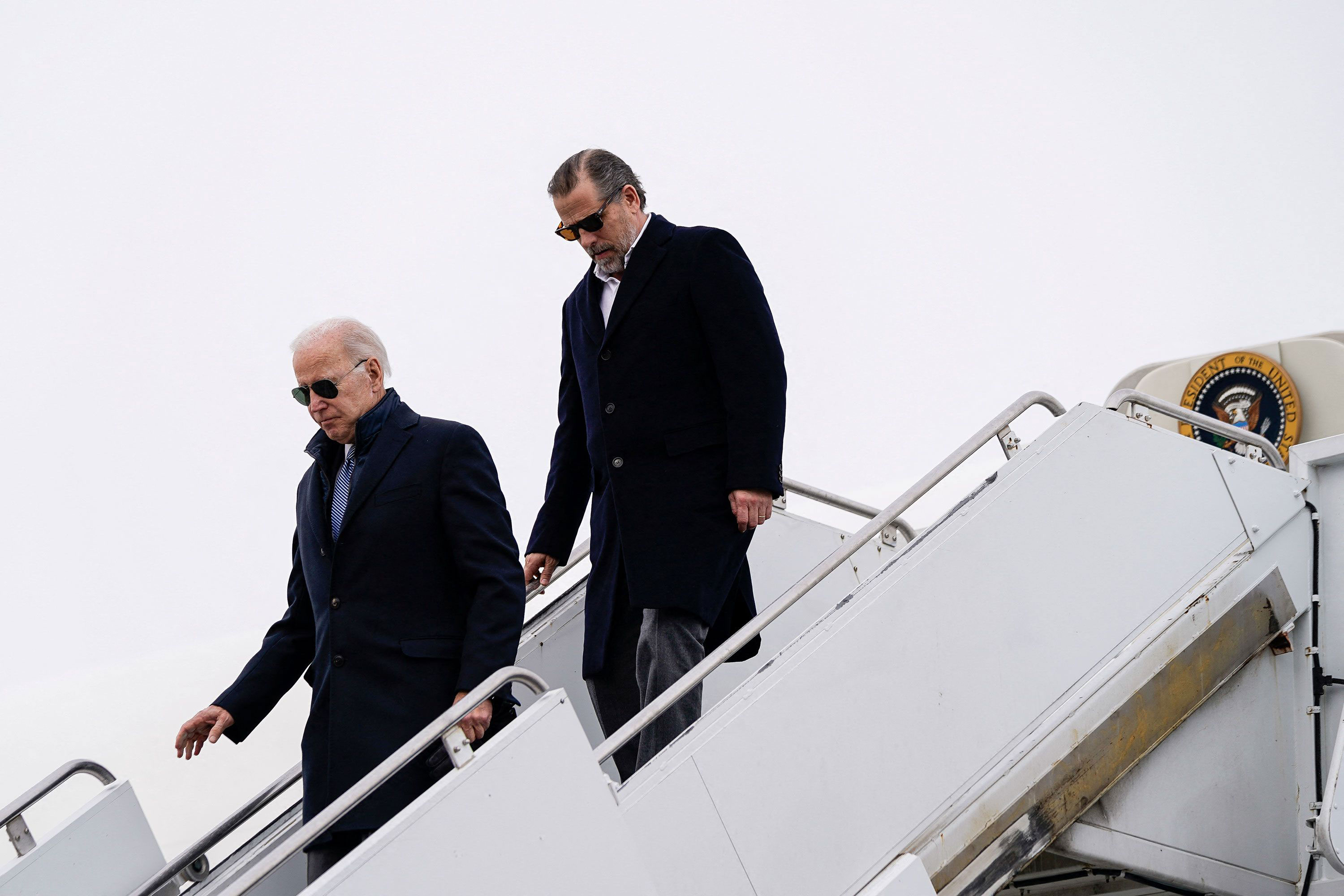 US President Joe Biden and son Hunter Biden disembark from Air Force One at Hancock Field Air National Guard Base in Syracuse, New York, on February 4, 2023. 