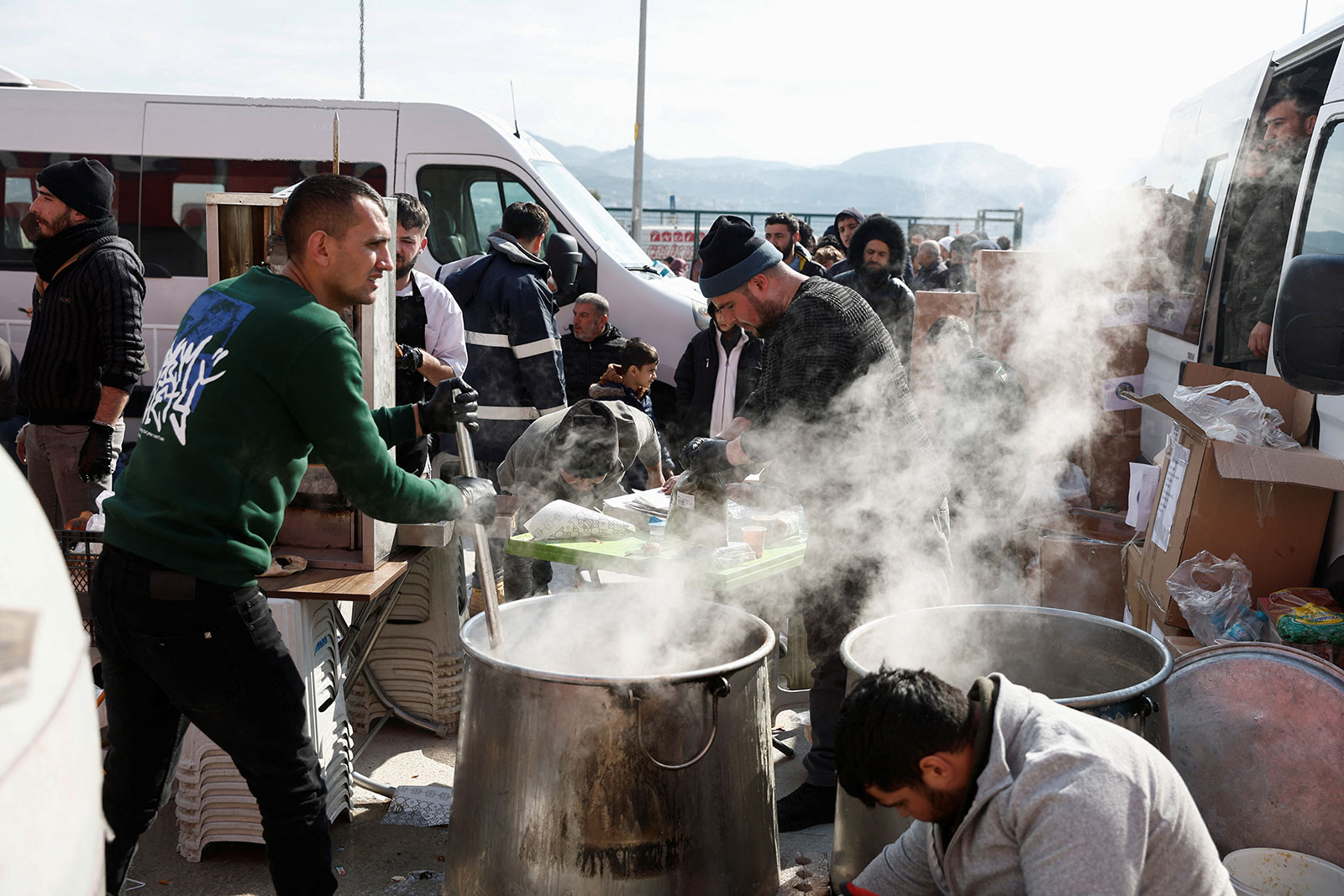 Volunteers prepare food for internally displaced people at the Yeni Hatay Stadium camp in Hatay, Turkey, on Friday. 